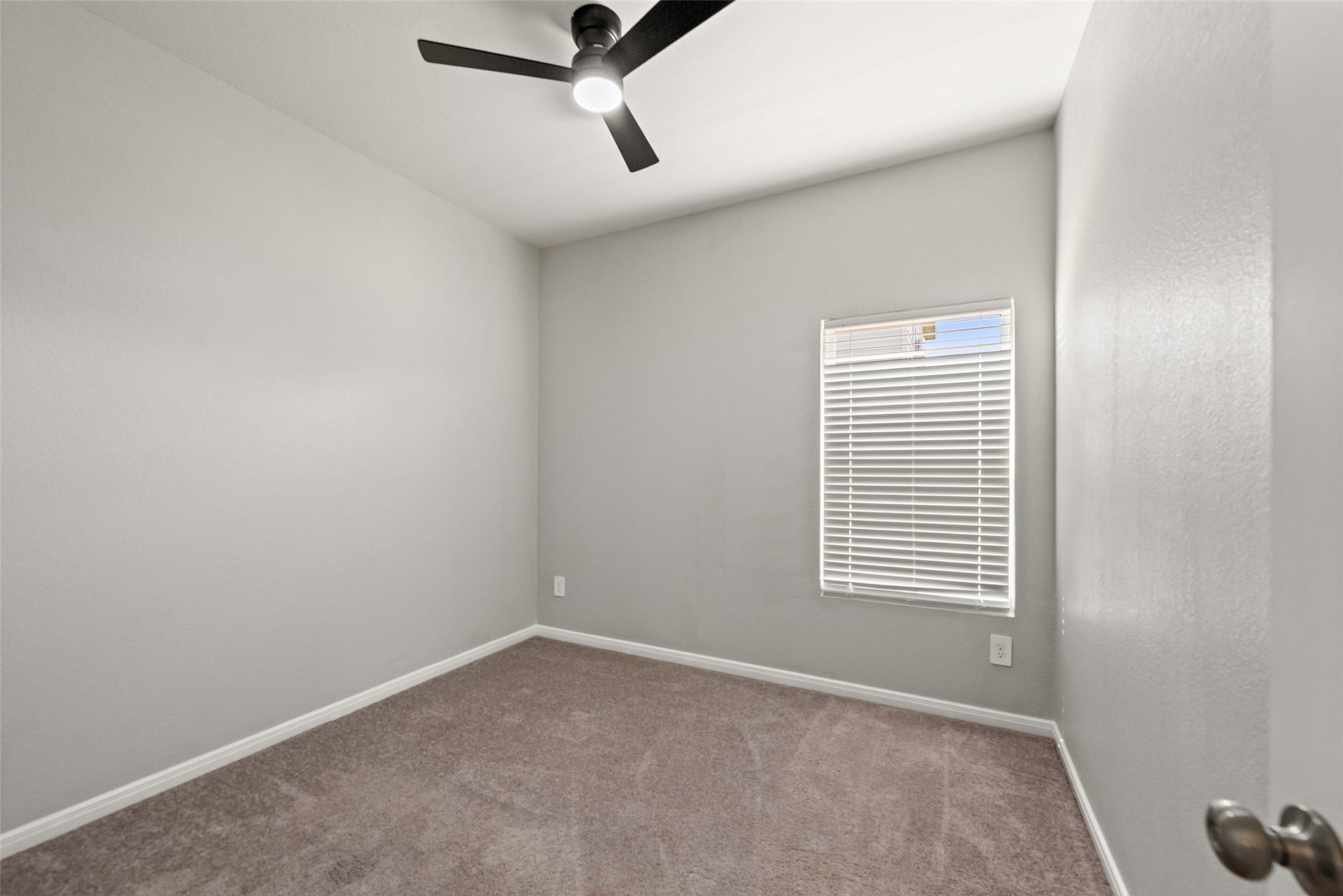 2537 18th Street, Hempstead, TX 77445 Comfortable bedroom featuring neutral finishes, carpet flooring, ceiling fan, and natural light.