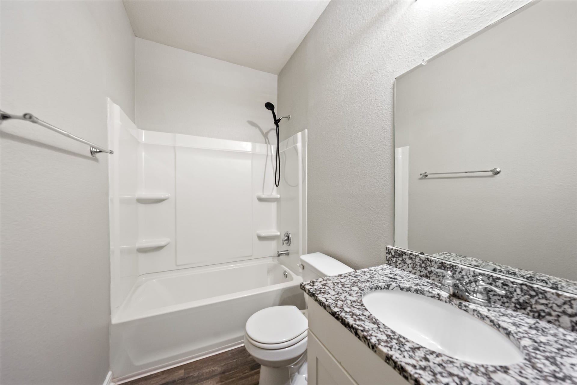 2537 18th Street, Hempstead, TX 77445 Full bathroom featuring a tub/shower combination, granite-topped vanity, and bright neutral finishes.