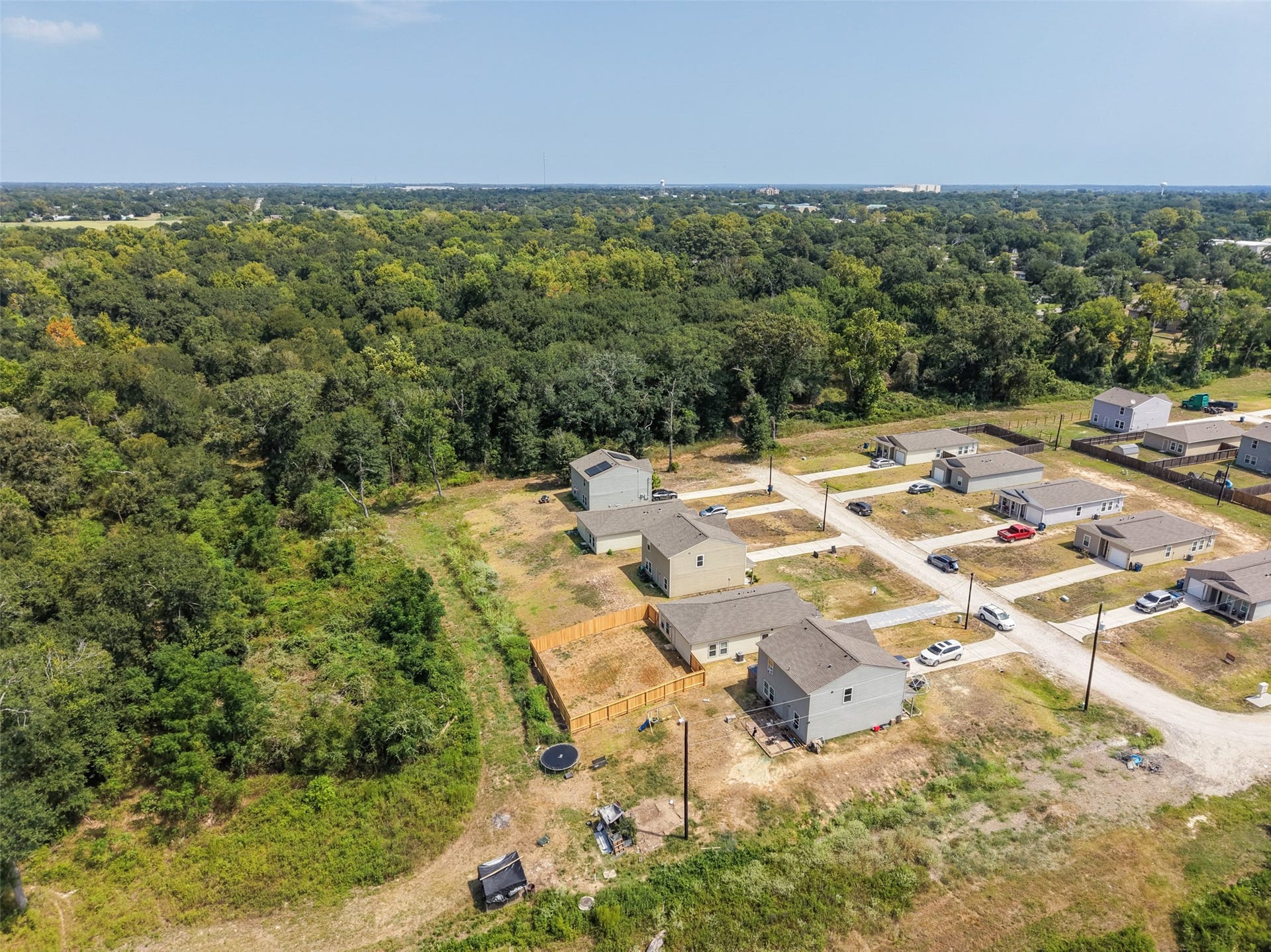 2537 18th Street, Hempstead, TX 77445 Aerial view showing the neighborhood layout, residential construction, and surrounding natural landscape.