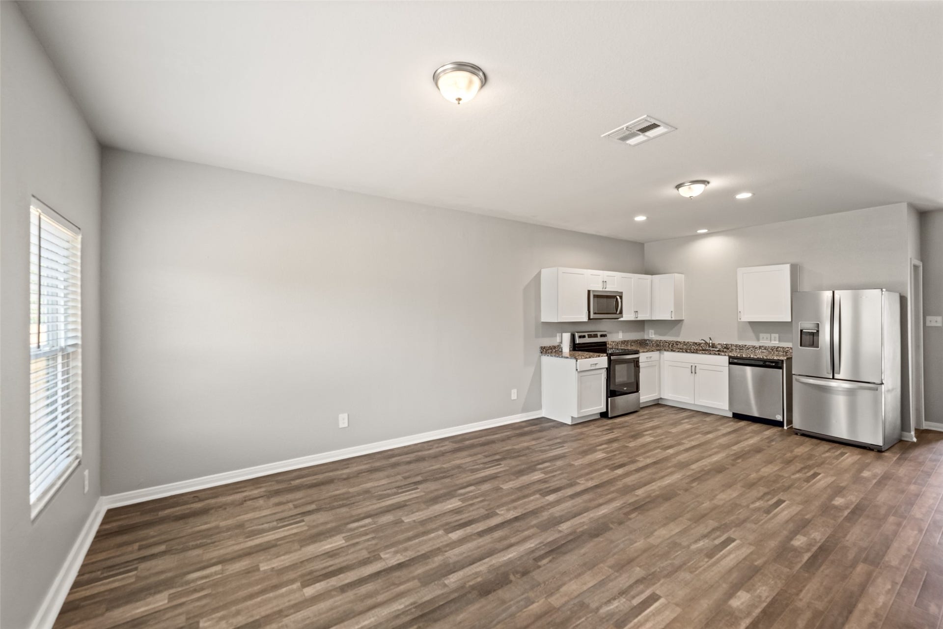 2537 18th Street, Hempstead, TX 77445 Open-concept living area with generous space for seating and a seamless connection to the kitchen and dining area