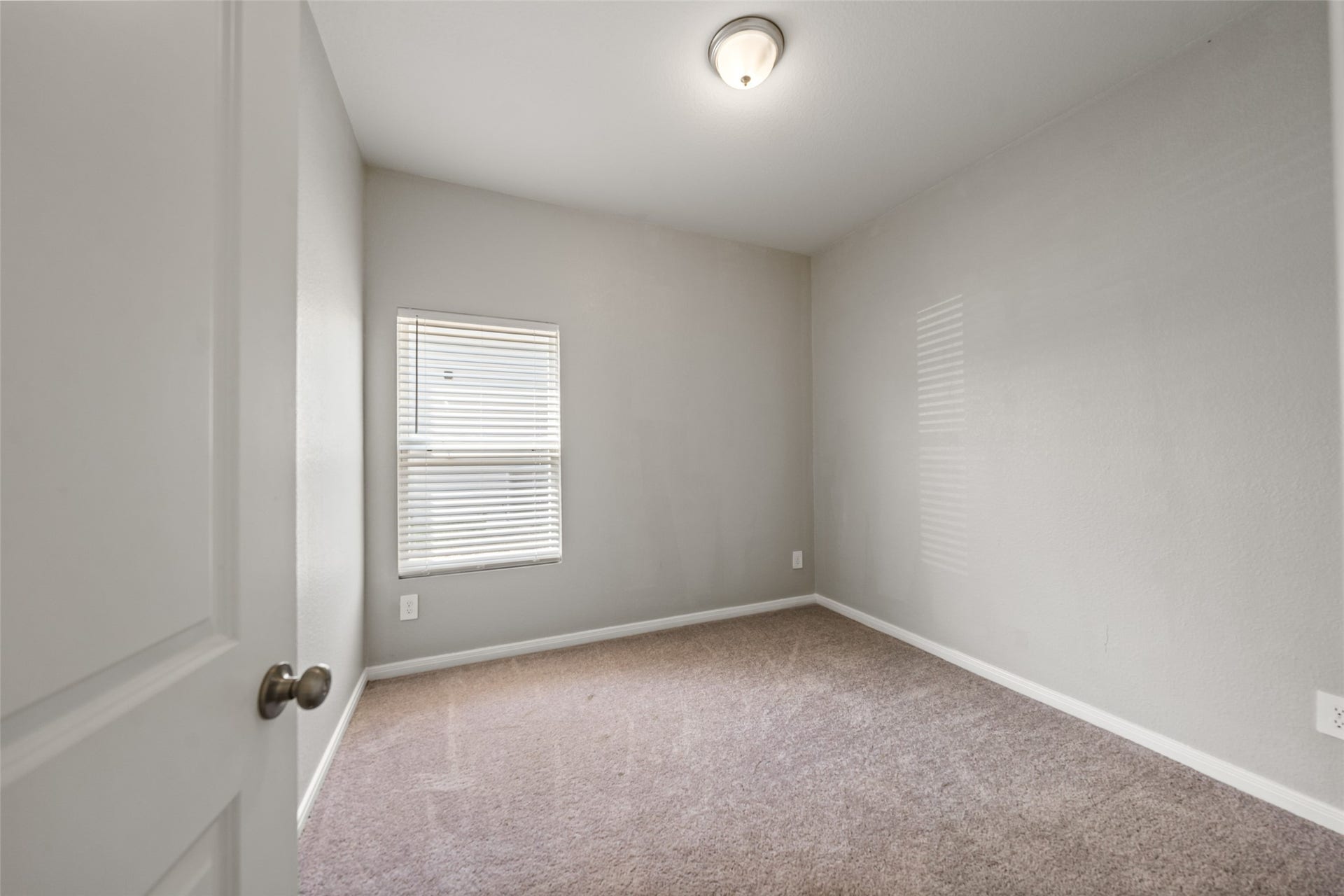 2537 18th Street, Hempstead, TX 77445 Secondary bedroom featuring carpet flooring, neutral finishes, and natural light.