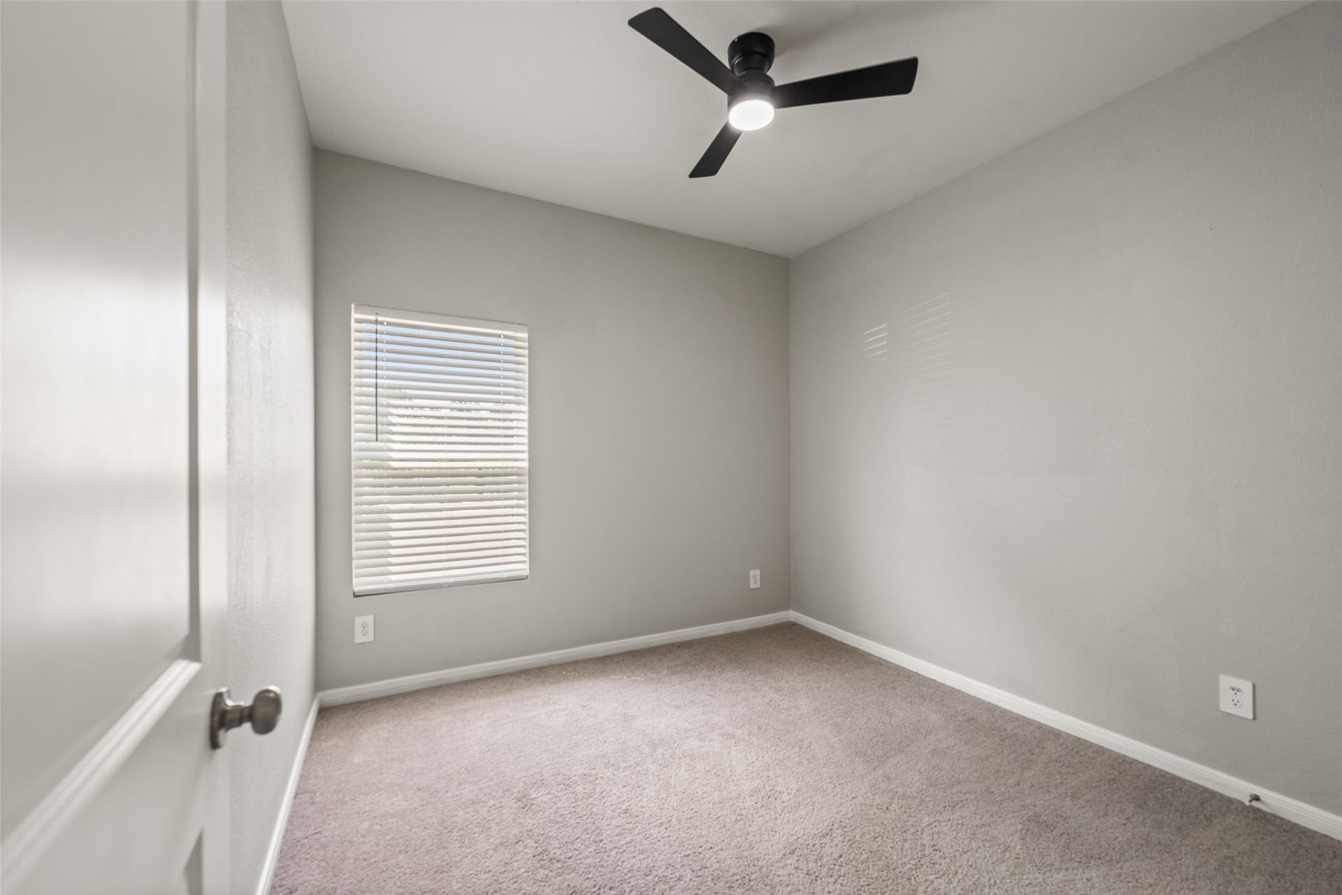2537 18th Street, Hempstead, TX 77445 Additional bedroom view highlighting the neutral color palette, carpet flooring, ceiling fan, and closet space.