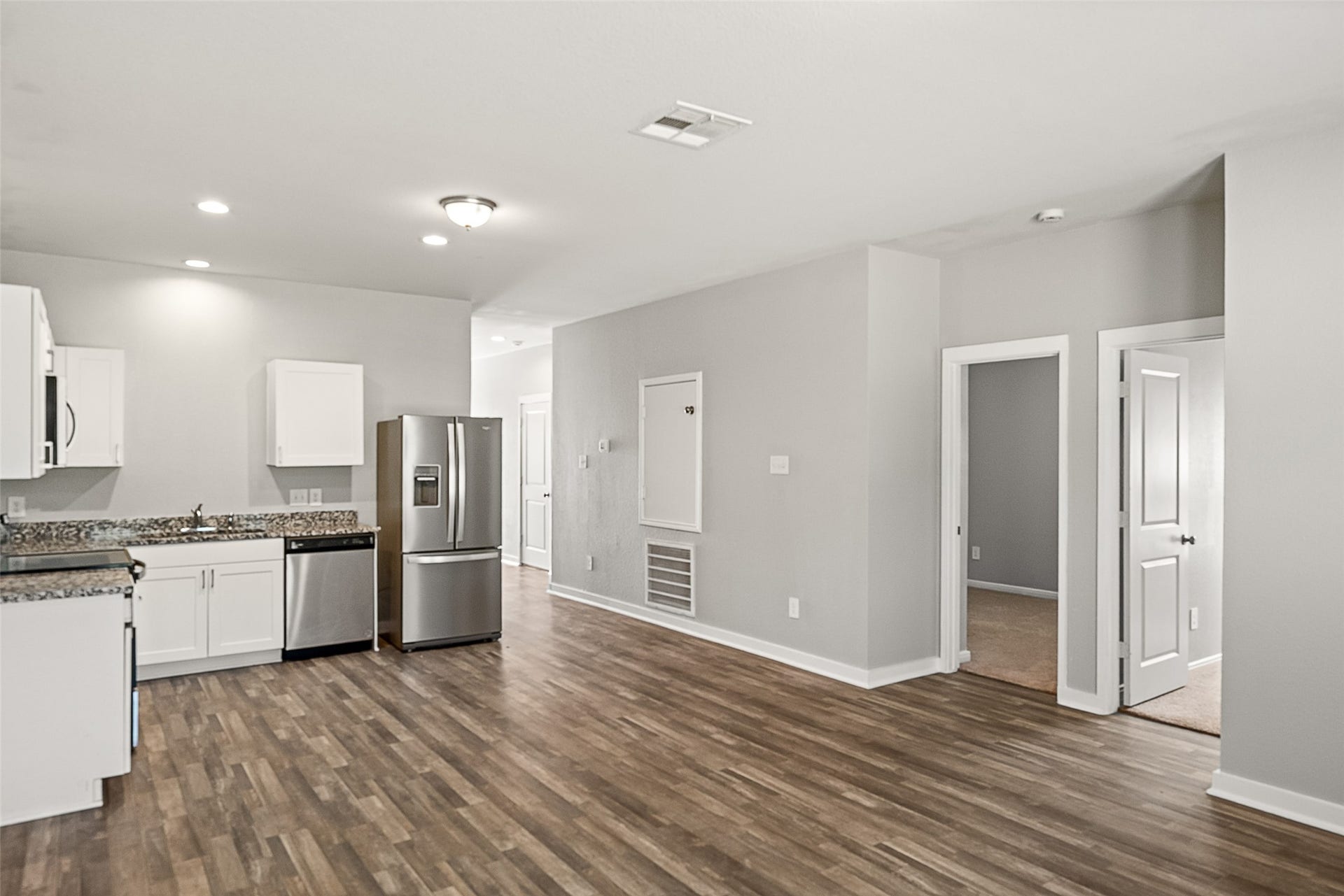 2537 18th Street, Hempstead, TX 77445 Wide interior view showcasing the open floor plan connecting the kitchen, dining, and living spaces.