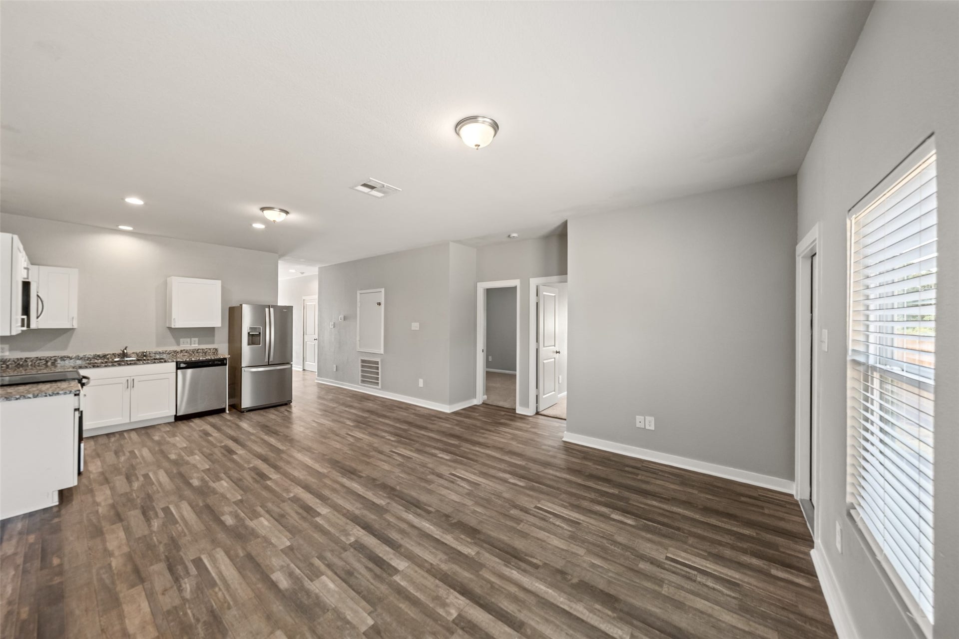 2537 18th Street, Hempstead, TX 77445 Bright main living area featuring recessed lighting, wood-look flooring, and an open layout designed for everyday living