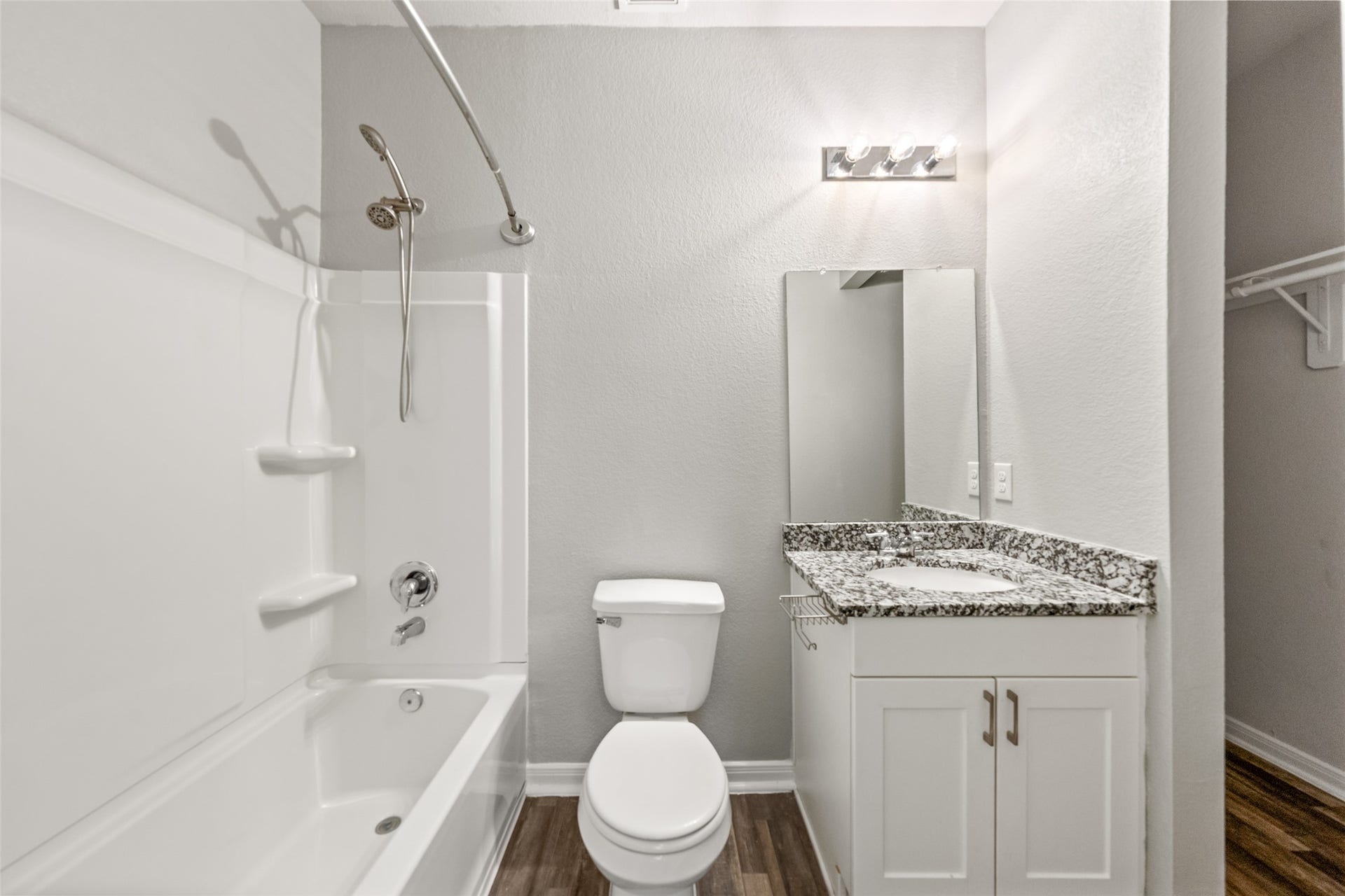 2537 18th Street, Hempstead, TX 77445 Additional bathroom view highlighting the tub/shower combination, vanity with storage, and granite countertop.