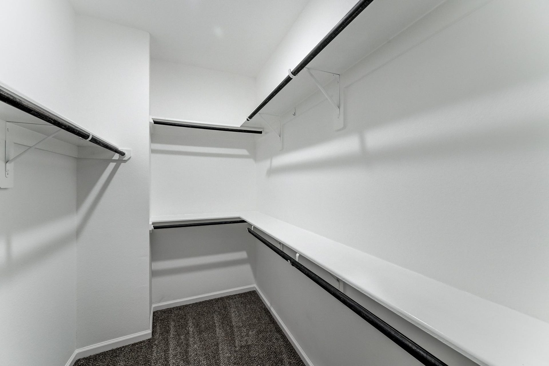 Spacious walk in closet with build ins