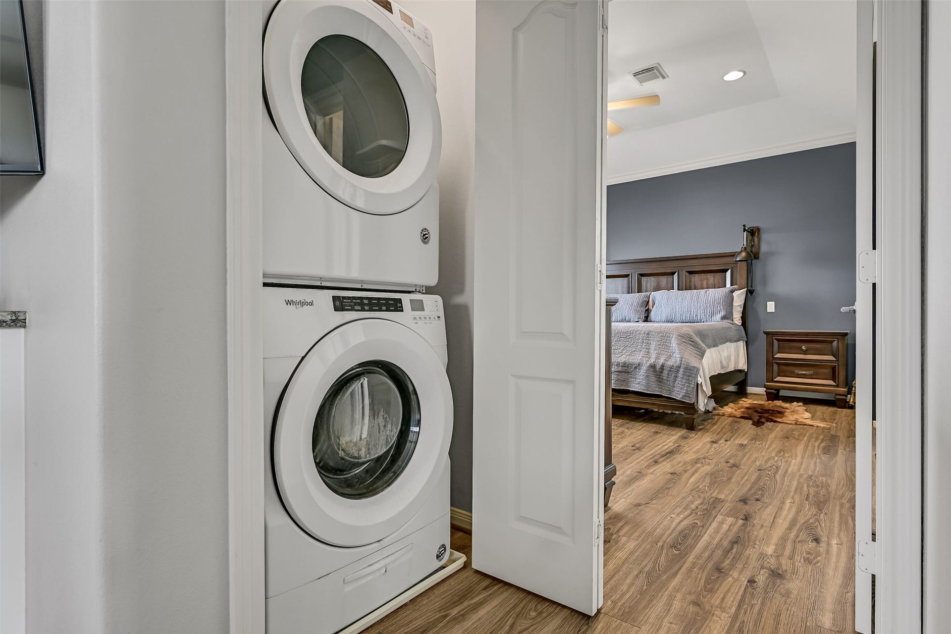7119 Beau Rue Street, Hitchcock, TX 77563 Before progressing to the bedrooms, we come to the stacking full-size washer/dryer area. Conveniently located within steps of the primary bedroom, as well as secondary bedrooms.