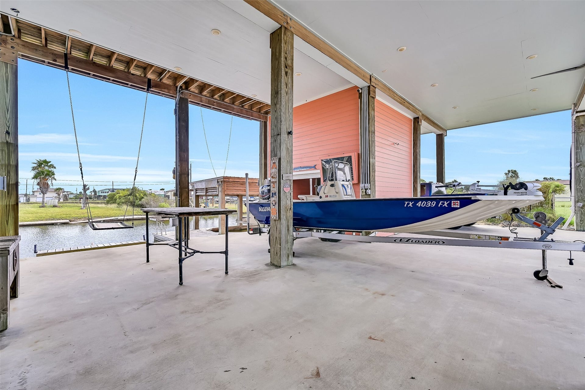 7119 Beau Rue Street, Hitchcock, TX 77563 Look at all of this covered entertaining space, which would also be perfect for extra parking. As you can see the boat trailer is stored here.