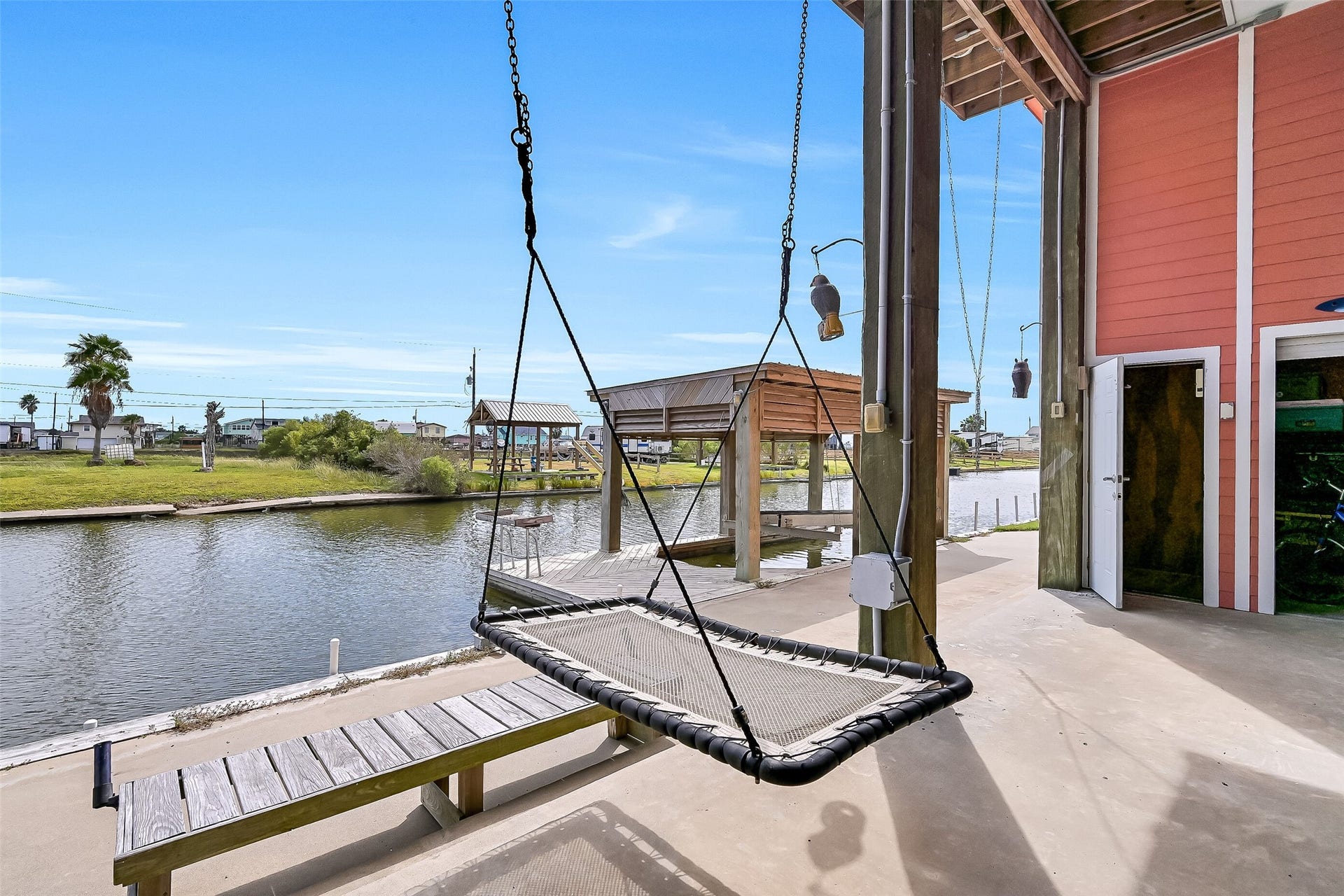 7119 Beau Rue Street, Hitchcock, TX 77563 Relax here with a canal view backdrop.