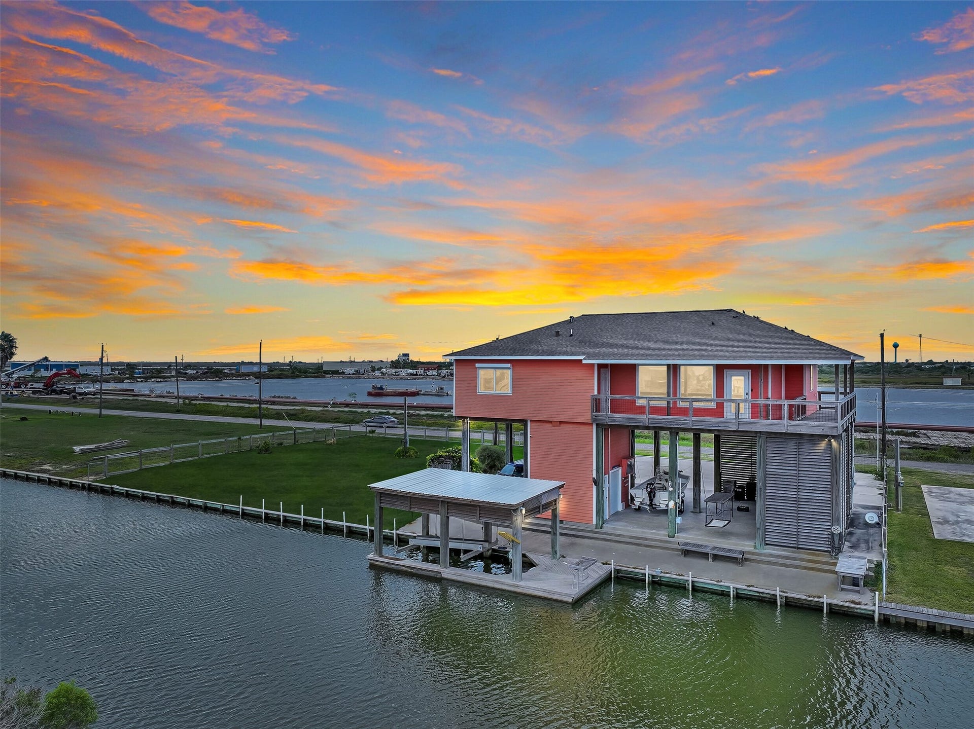 7119 Beau Rue Street, Hitchcock, TX 77563 Welcome to your waterfront paradise, located within a gated subdivision. Whether you are into fishing, birding, boating, kayaking, or paddleboarding - this home will immerse you in it all. Get ready to witness the most unbelievable sunsets imaginable!