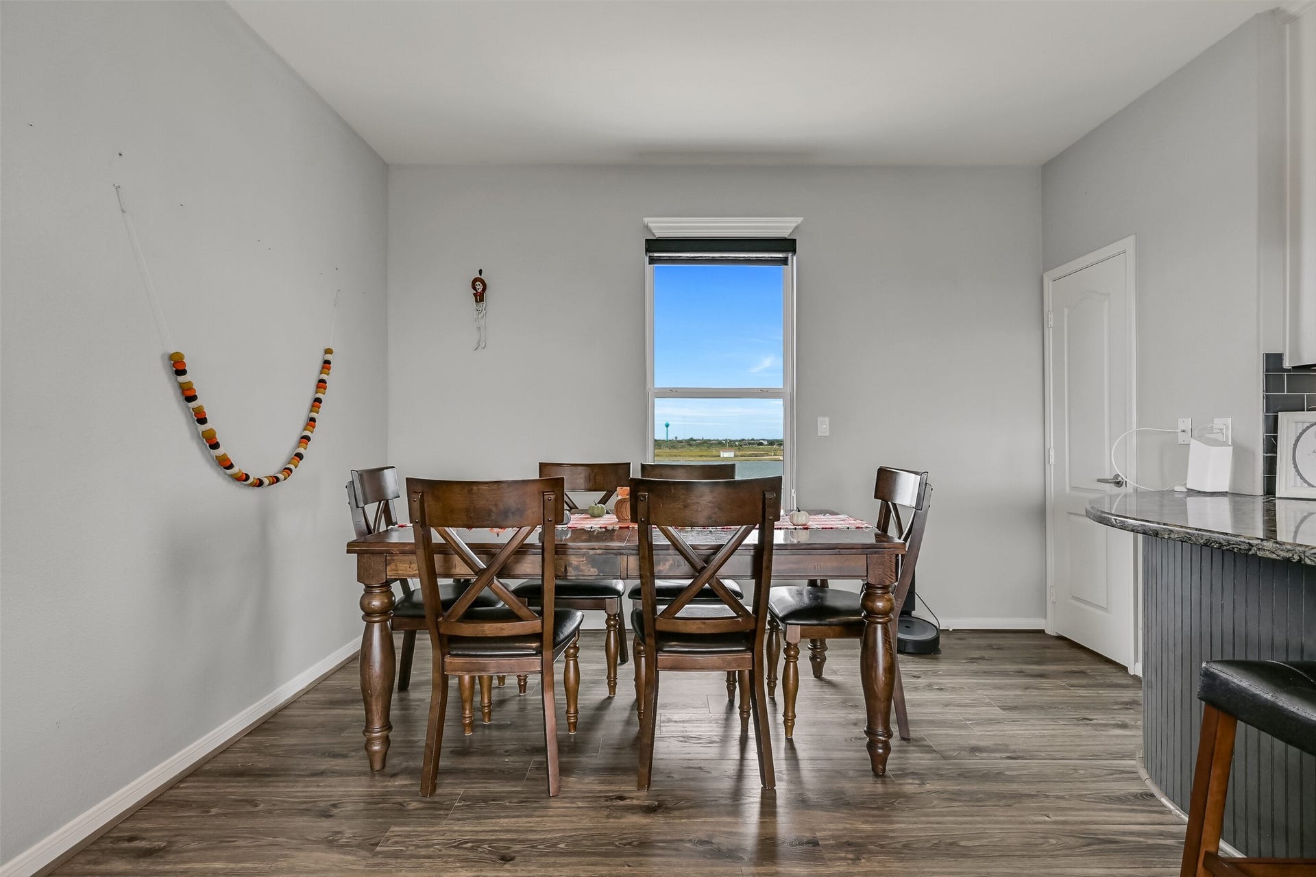 7119 Beau Rue Street, Hitchcock, TX 77563 Dining area with a backdrop of Highland Bayou.
