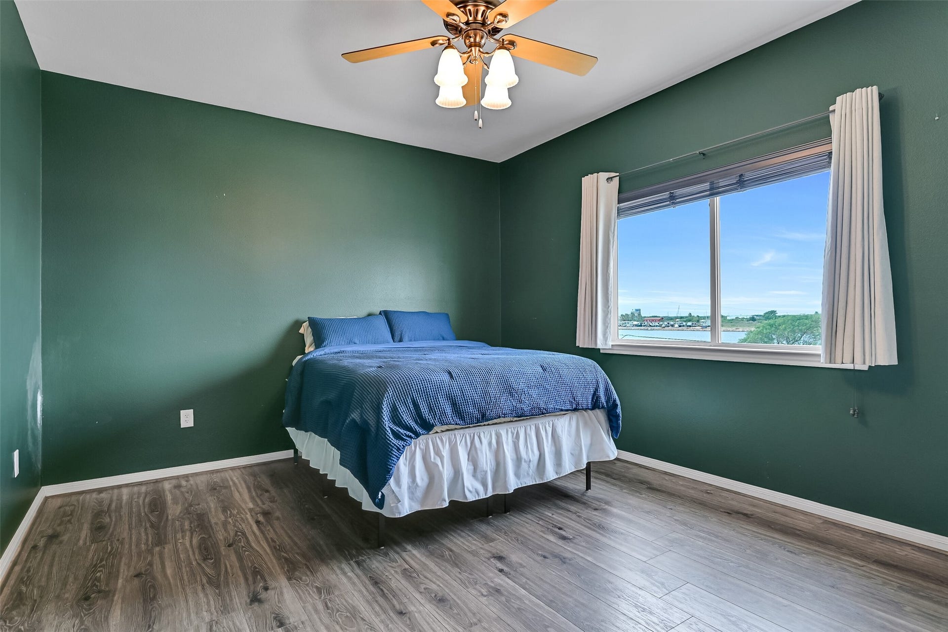 7119 Beau Rue Street, Hitchcock, TX 77563 Secondary bedroom with views of Highland Bayou. Notice there is no carpet in any of the bedrooms.