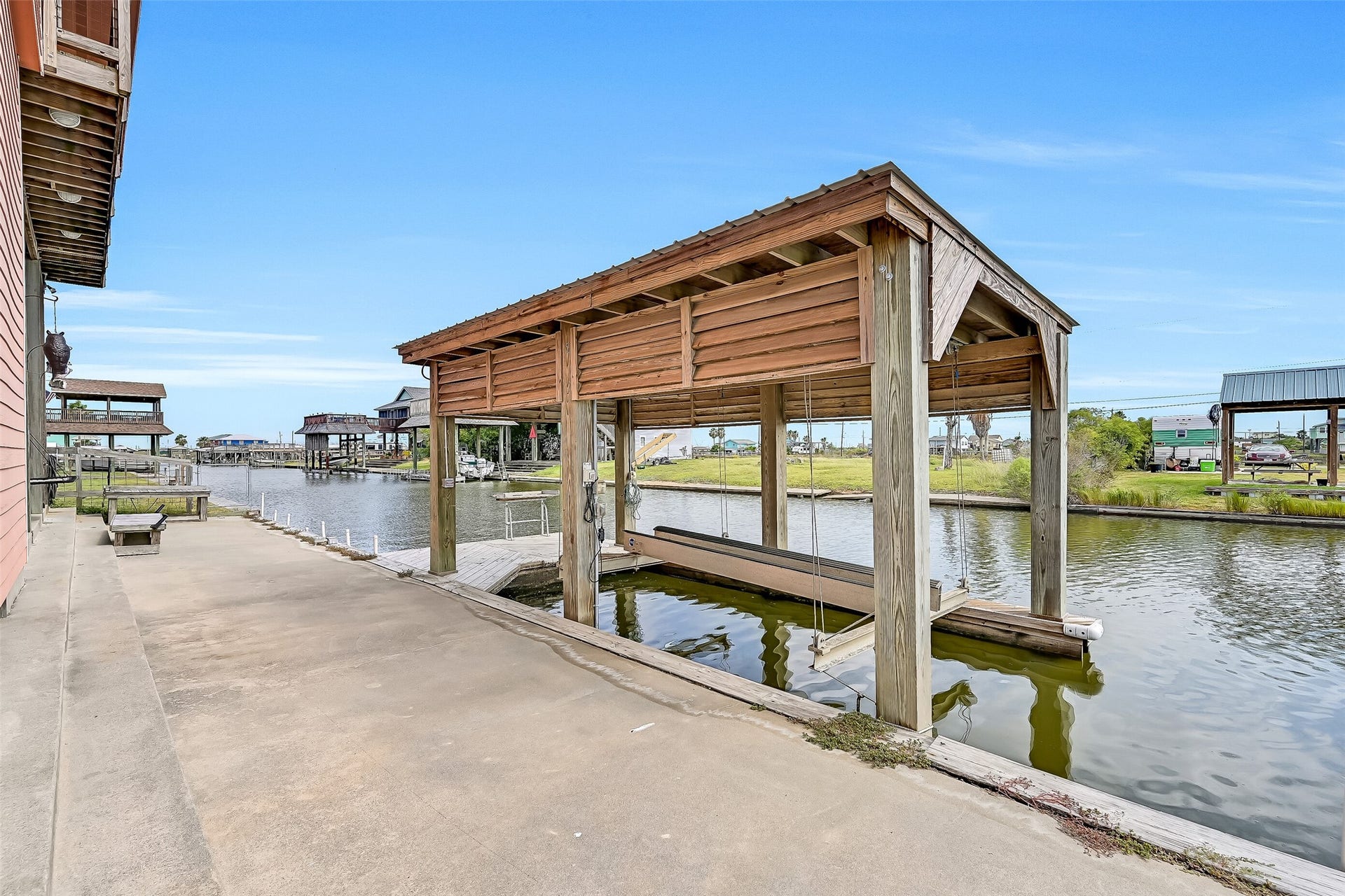 7119 Beau Rue Street, Hitchcock, TX 77563 Boathouse with boat lift