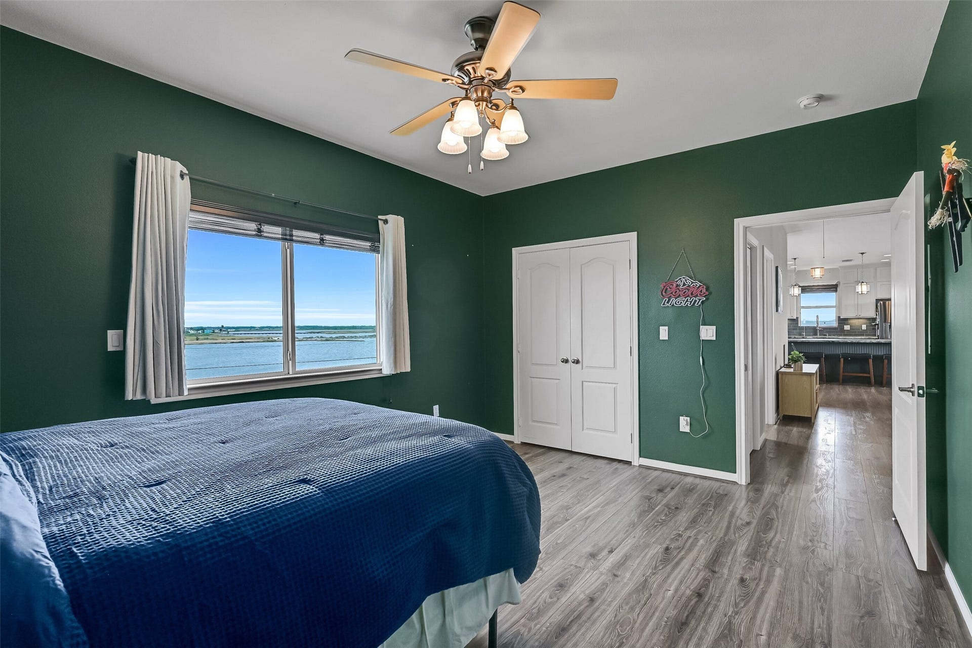 7119 Beau Rue Street, Hitchcock, TX 77563 These views are what your guests will be able to wake up to! Double doors reveal a nice-sized closet. Notice the wall switch to the left of the window - which controls the electric storm shutter.
