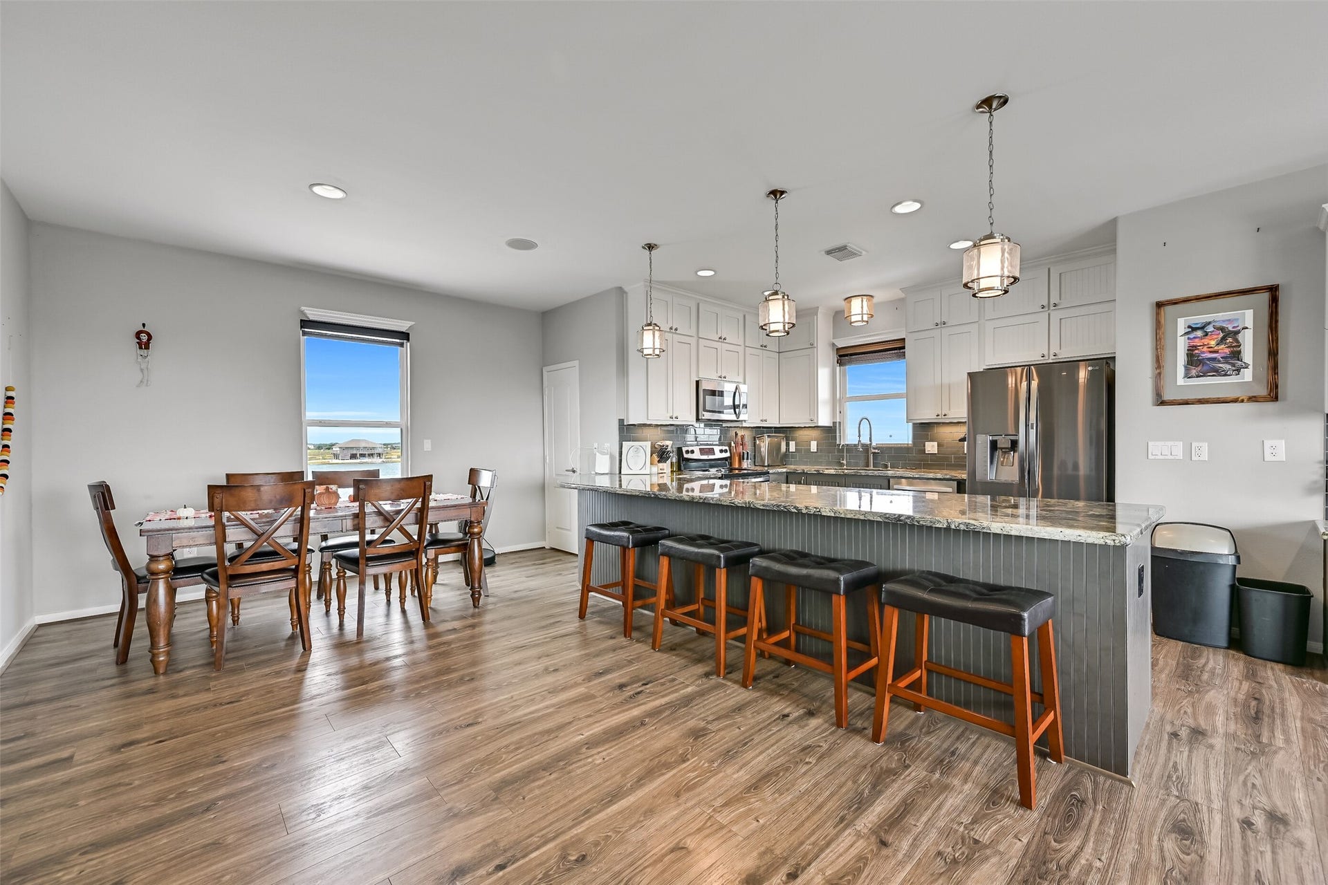 7119 Beau Rue Street, Hitchcock, TX 77563 Now we come to the heart of this home. The showstopper kitchen, which is open to the rest of the entertaining areas. Notice it is also open to the dining area giving you so many seating options.