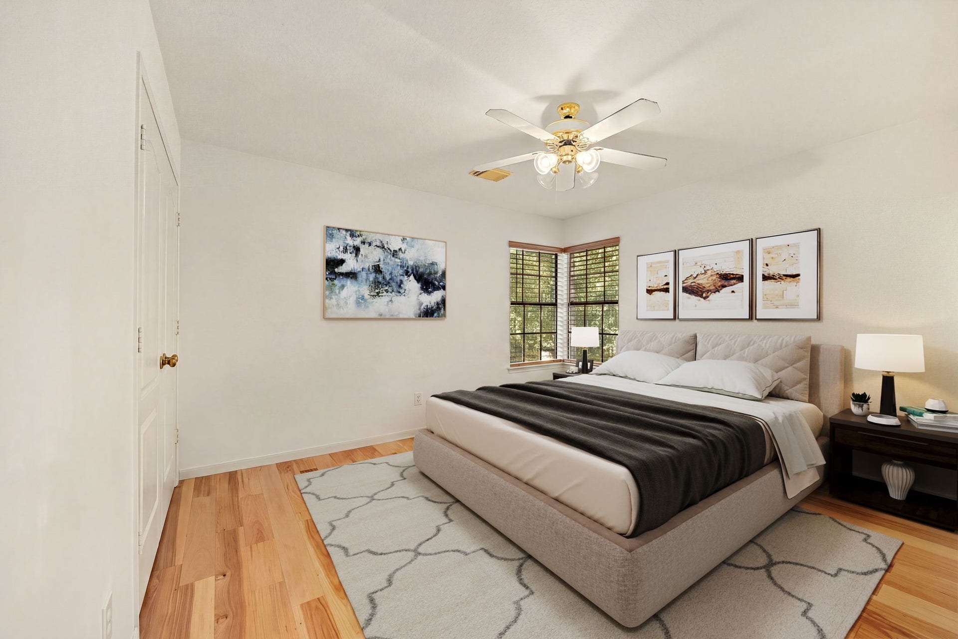 205 Purple Slate Place, The Woodlands, TX 77381 This well appointed secondary bedroom features an en-suite bathroom. Corner windows outfitted with clean blinds look out onto the surrounding greenery, filling the room with a warm and inviting atmosphere. The seamless wood flooring and timeless layout make this versatile space ideal for a growing family. *Virtually Staged