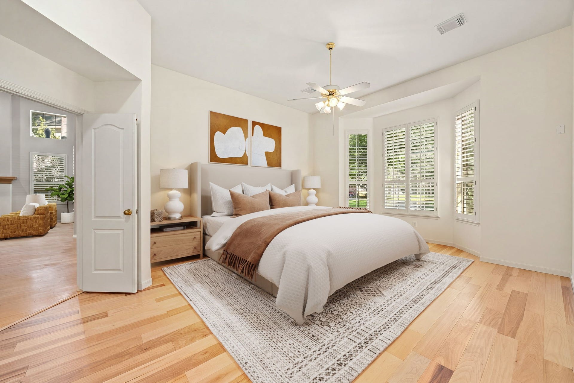 205 Purple Slate Place, The Woodlands, TX 77381 This desirable main-level primary bedroom combines spacious luxury with practical everyday function. The room is anchored by beautiful floors and a generous layout that accommodates substantial furnishings with ease. A large three-panel bay window looks out over the surrounding greenery, while the private entryway configuration ensures a quiet, secluded feel while remaining just steps away from the heart of the home. *Virtually Staged