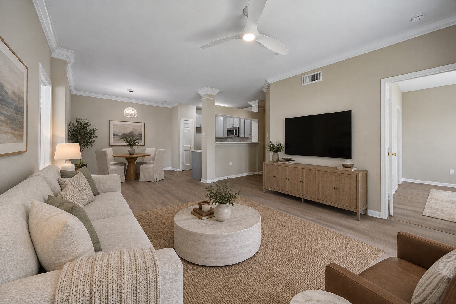 3231 Allen Parkway, #1216, Houston, TX 77019 This unit was extensively updated in '26. Features a newer HVAC ('23), water heater ('23), freshly painted interior, double-pane windows, new floors. View of the wonderful living room highlighting the generous space for comfortable seating & furnishings. Open to the dining area & kitchen w/ convenient access to both bedrooms, creating an inviting layout for everyday living & entertaining. Photo is virtually stage.