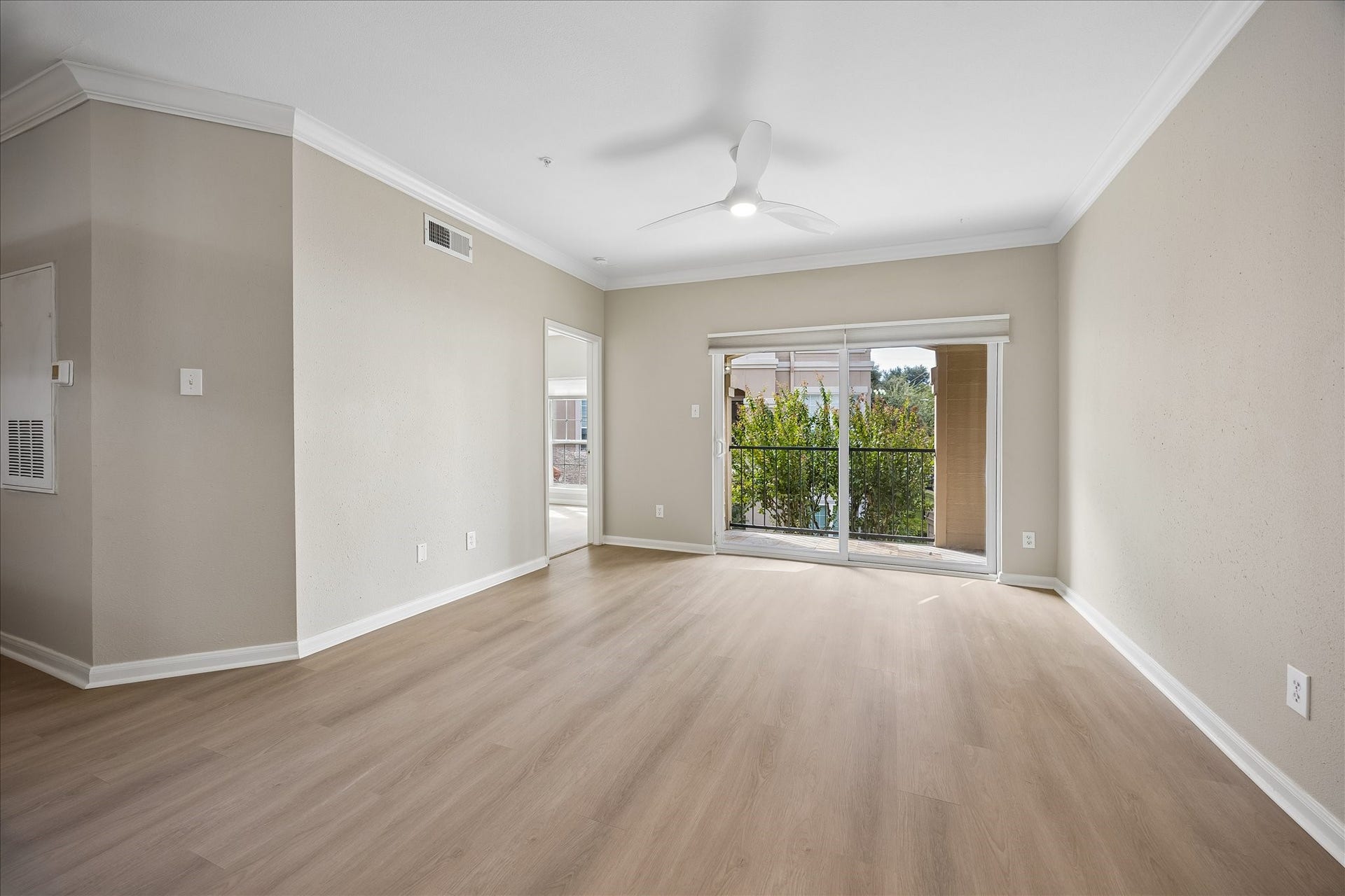 3231 Allen Parkway, #1216, Houston, TX 77019 View of the living room looking towards the sliding doors that open to your private balcony. Door to the upper left leads to the guest bedroom. Unit comes with 2 parking spots in covered garage parking. HOA includes cable TV, exterior insurance, limited access gate, security patrol, rec facilities, water, sewer, trash & roof!Move-in ready/ lock-&-go living!