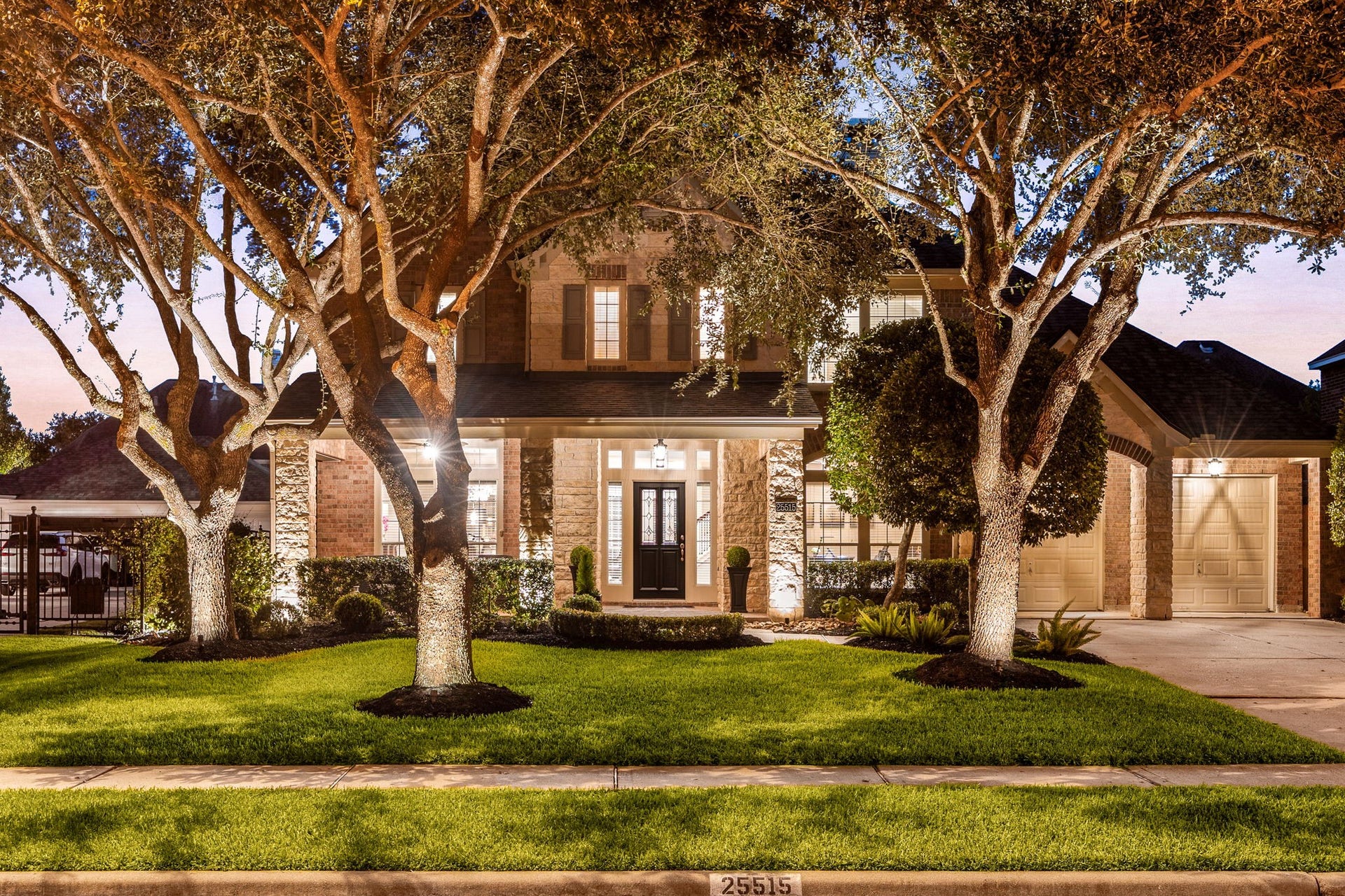 25515 Autumnwind Court, Katy, TX 77494 Impressive two-story brick home with a 2019 roof, upgraded exterior lighting and mature landscaping.