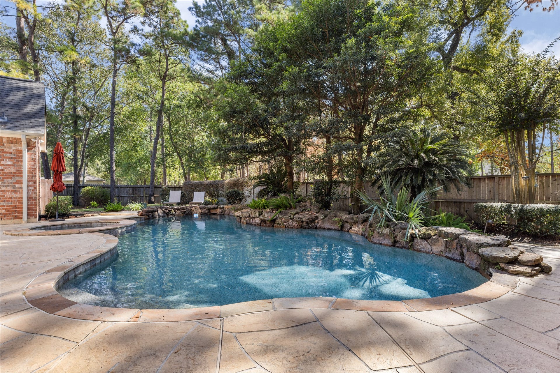 2214 Kings Trail, Kingwood, TX 77339 Pool with rock waterfall