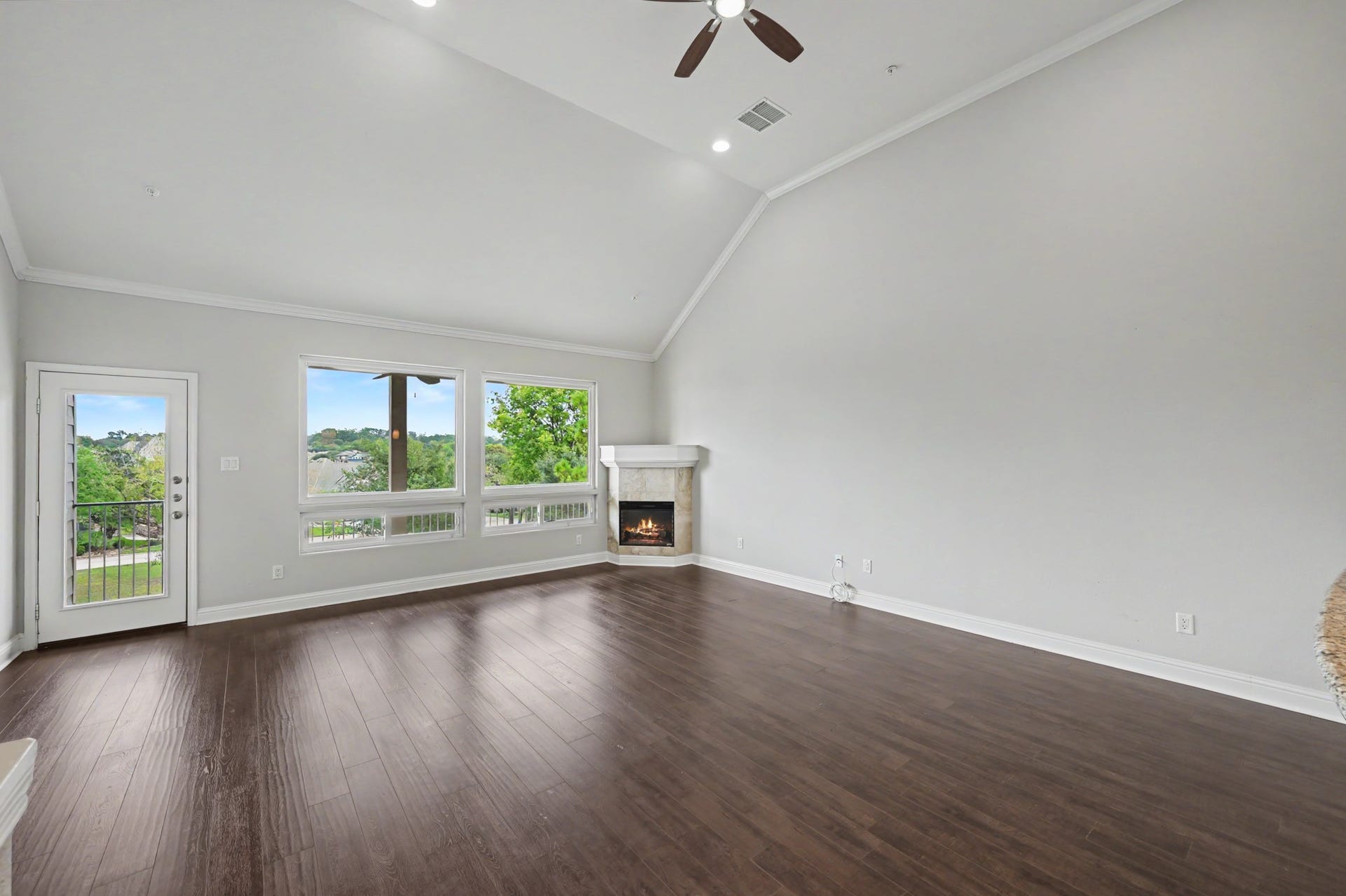 17570 W Highway 105 W, #52, Conroe, TX 77356 2nd floor living room and electric fireplace and balcony