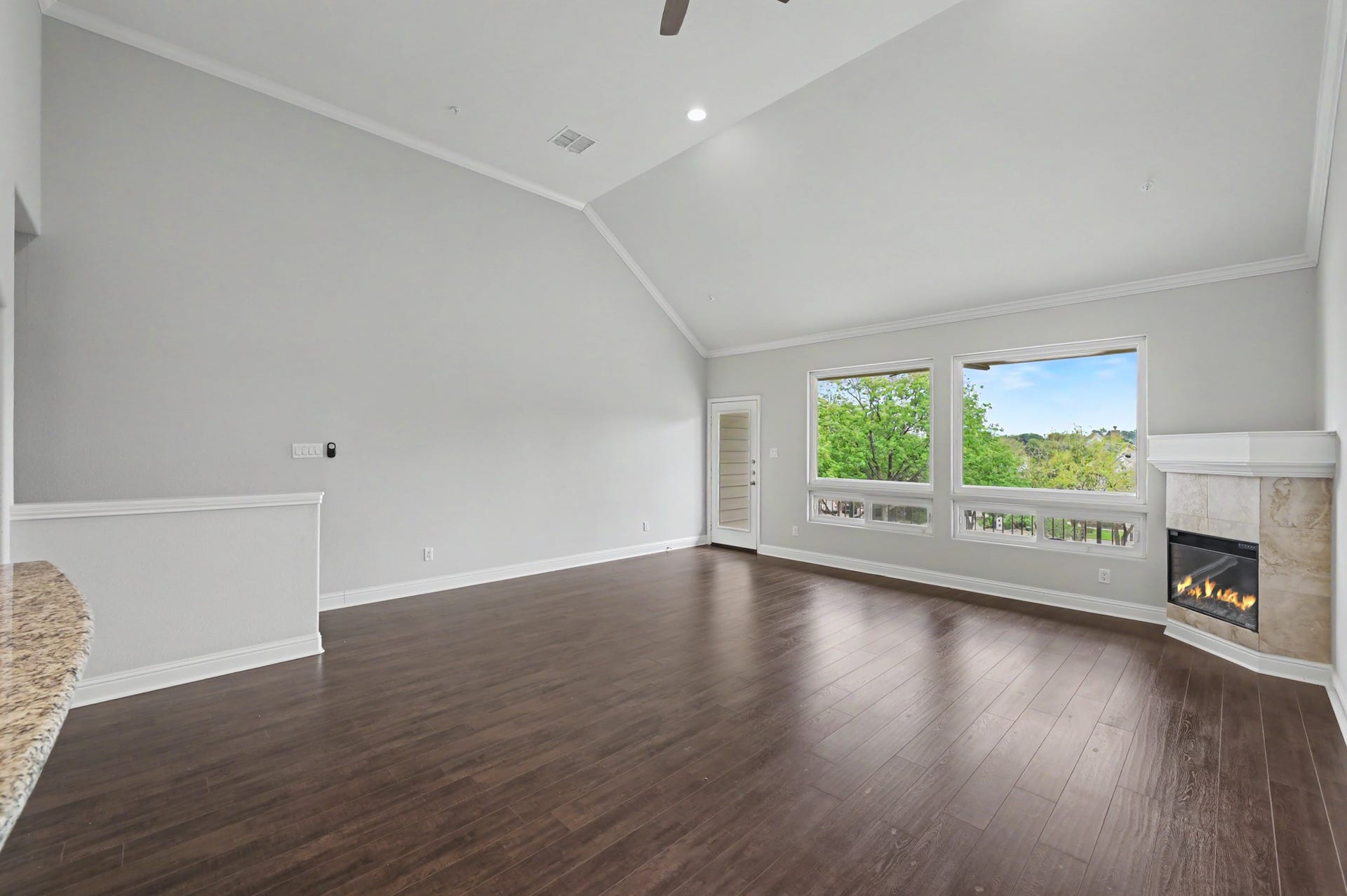 17570 W Highway 105 W, #52, Conroe, TX 77356 2nd floor living room and electric fireplace and balcony