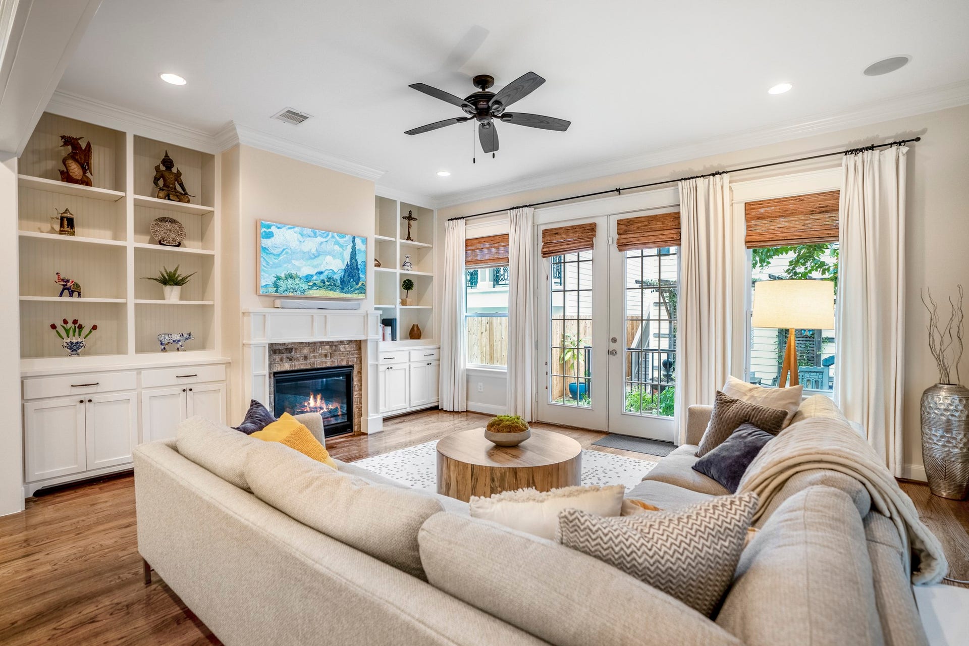 840 Tulane Street, Houston, TX 77007 Custom built-in book cases flank the gas fireplace. Double French doors lead to your gated backyard space.