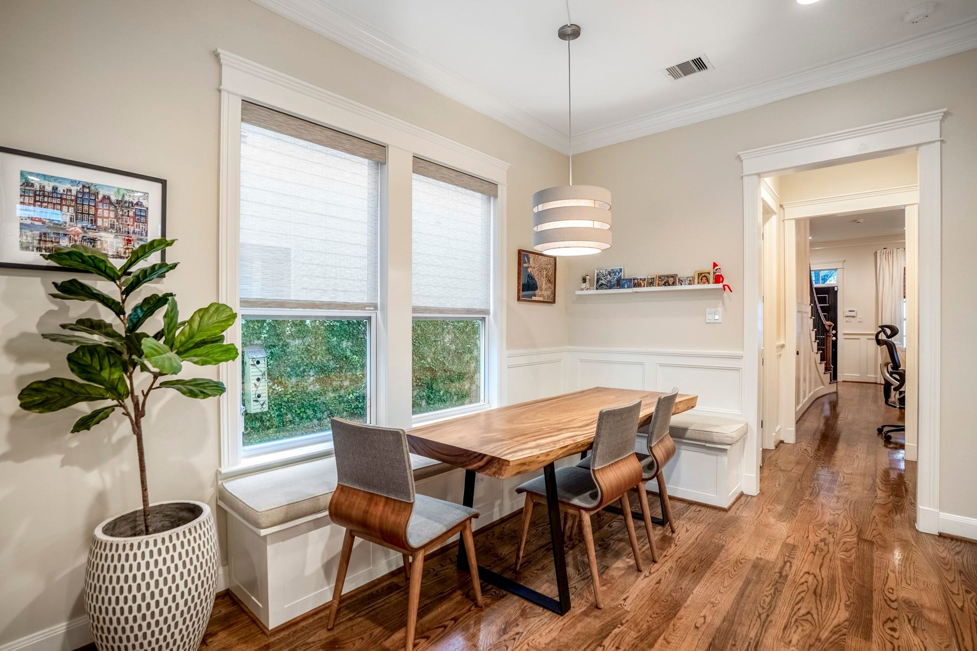 840 Tulane Street, Houston, TX 77007 Custom wood paneling and built-in bench seating in this breakfast nook adjacent to the island kitchen.