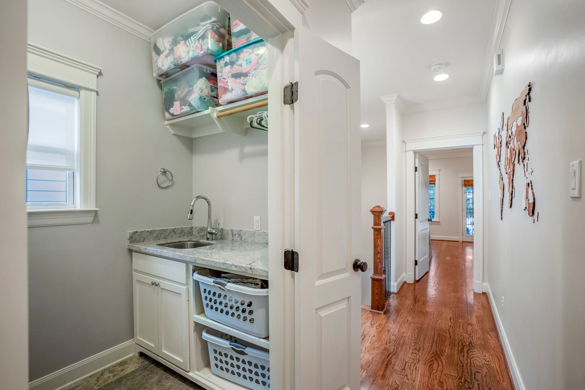 840 Tulane Street, Houston, TX 77007 Down the hallway to the other two bedrooms is your utility room with a folding counter and a sink.