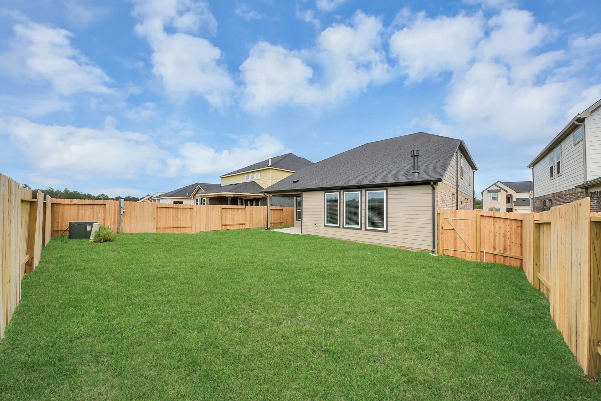 Experience outdoor living at its finest on this expansive covered patio, thoughtfully designed for BBQs and delightful outdoor dining.
