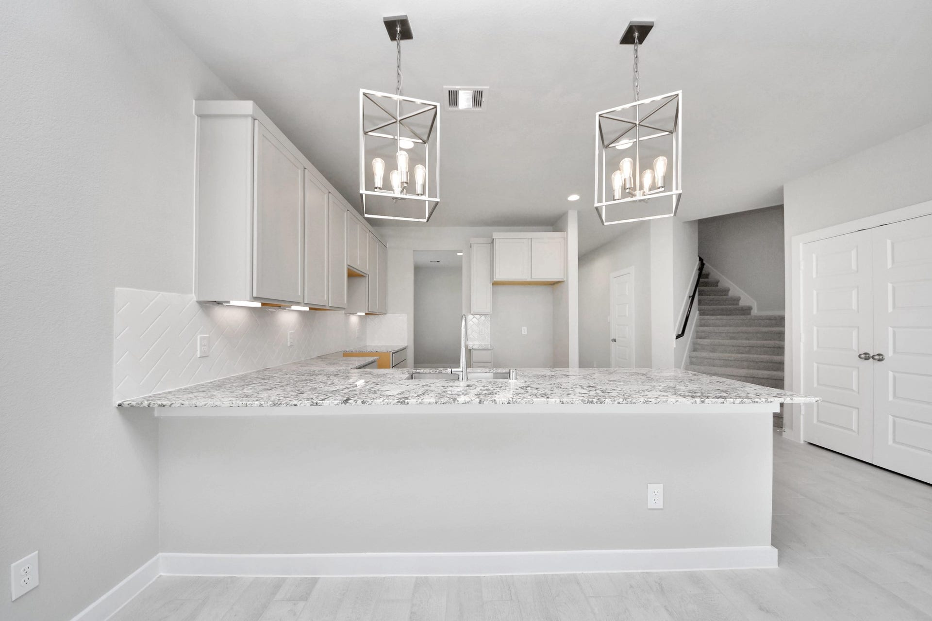 The open concept effortlessly connects the kitchen to the expansive family room, forming a perfect hub for gatherings. This seamless flow creates an inviting space where cooking and socializing come together harmoniously. Sample photo of completed home with similar floor plan. Actual colors and selections may vary.