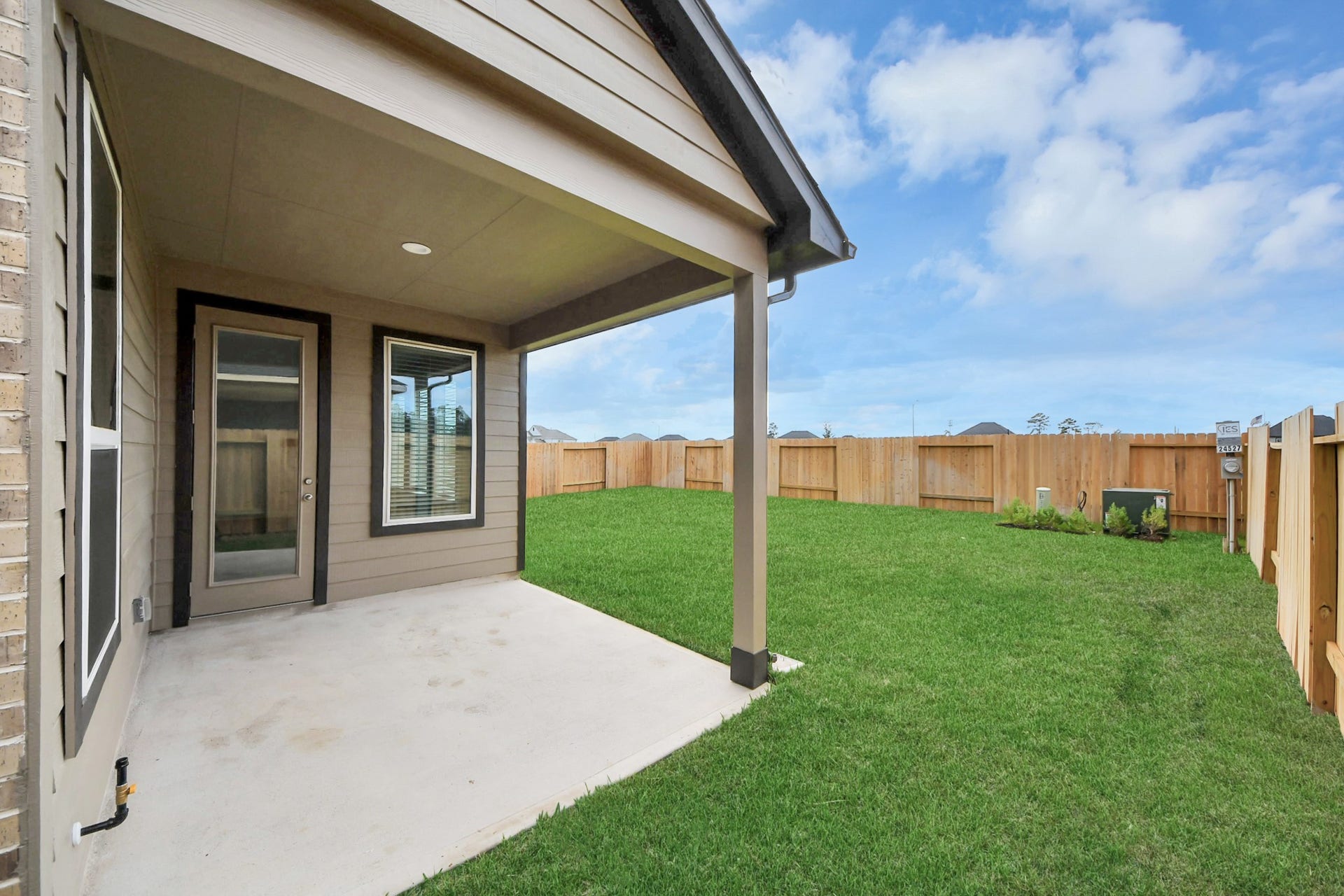 Come and see this spacious backyard with its beautiful covered patio. There is plenty of room for the kids to play and adults to relax. Perfect for your outdoor living space, patio furniture, bbq pit, and so much more. The possibilities are endless!