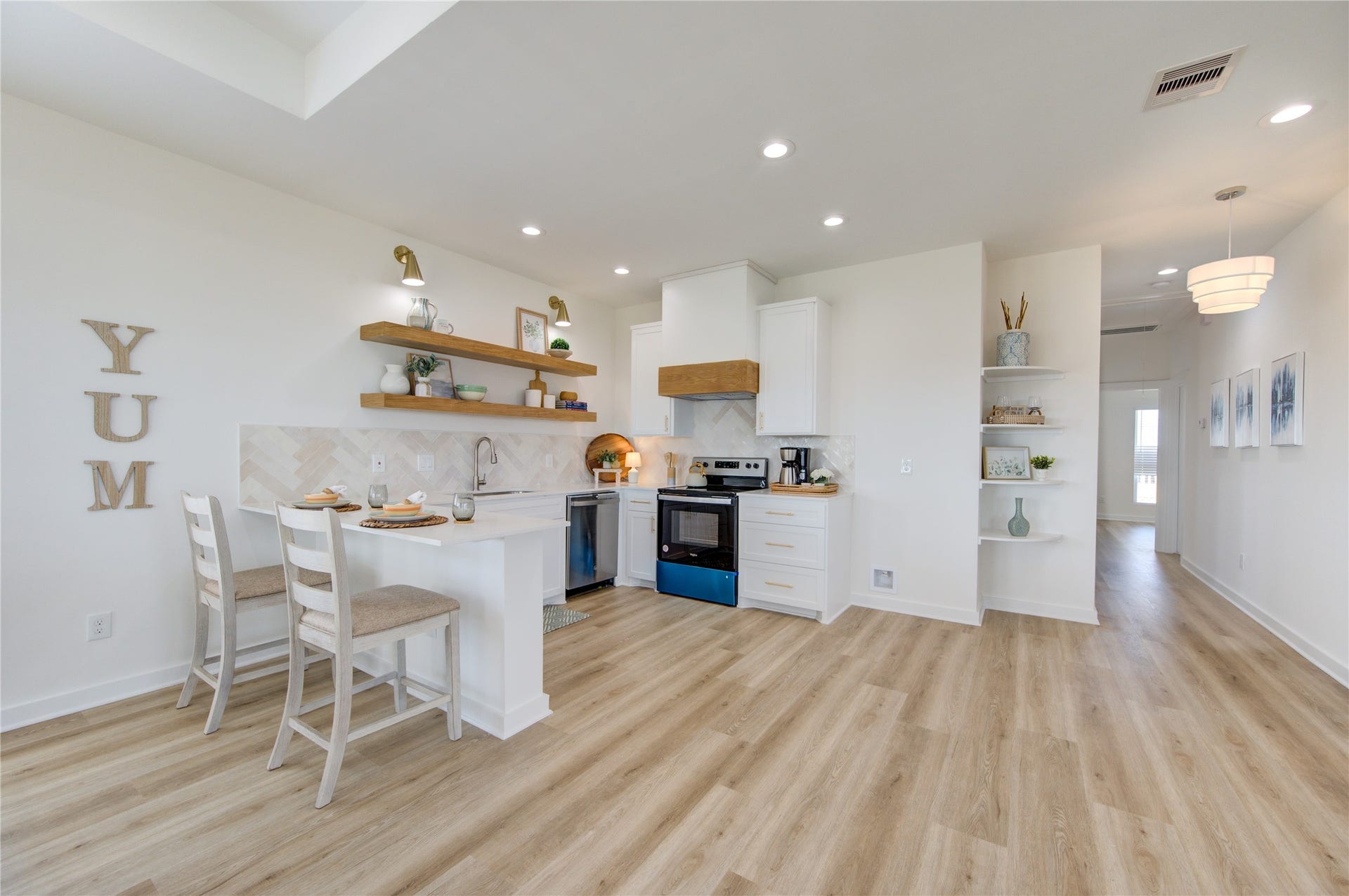 1014 Treaty Dr, Surfside Beach, TX 77541 Open-concept layout combining kitchen, dining, and living areas