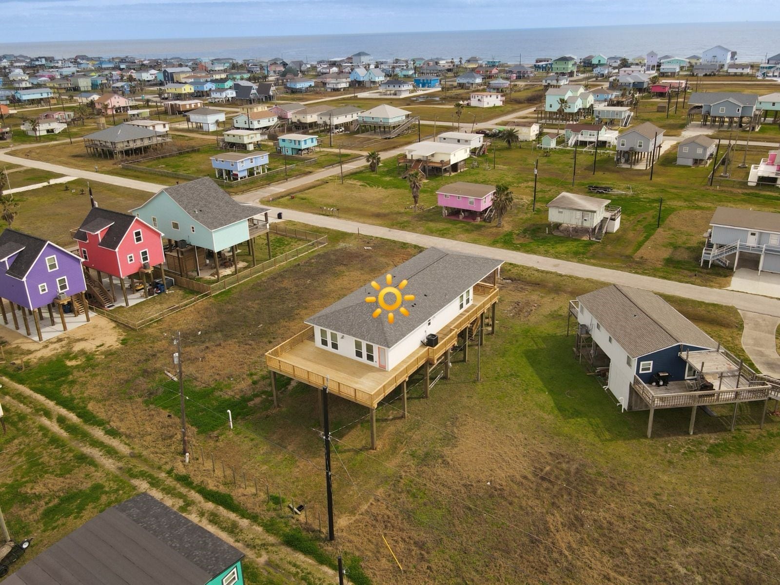 1014 Treaty Dr, Surfside Beach, TX 77541 Aerial perspective showcasing surrounding homes and community layout