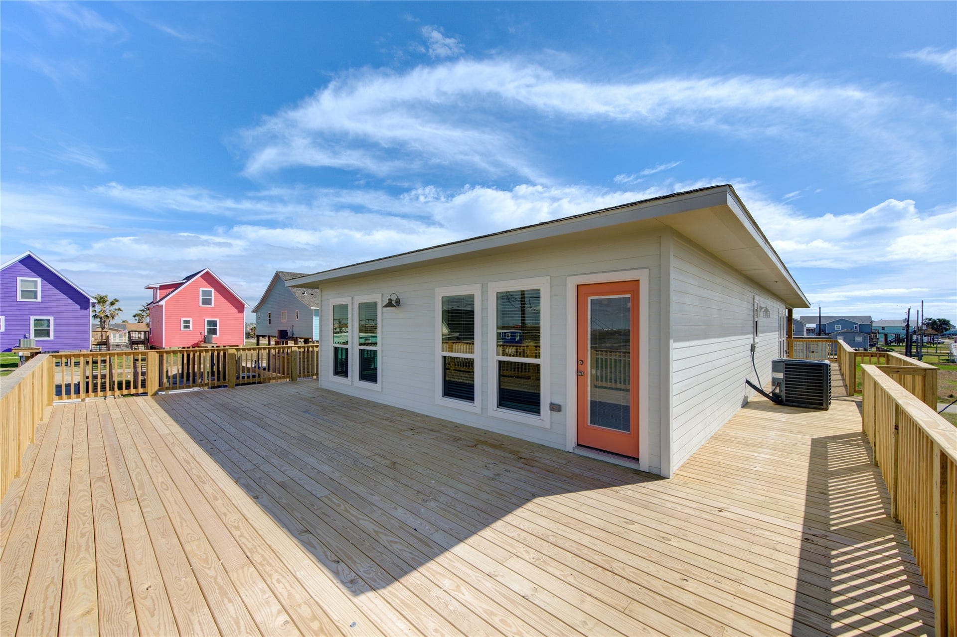 1014 Treaty Dr, Surfside Beach, TX 77541 Rear exterior showcasing modern construction and spacious outdoor area