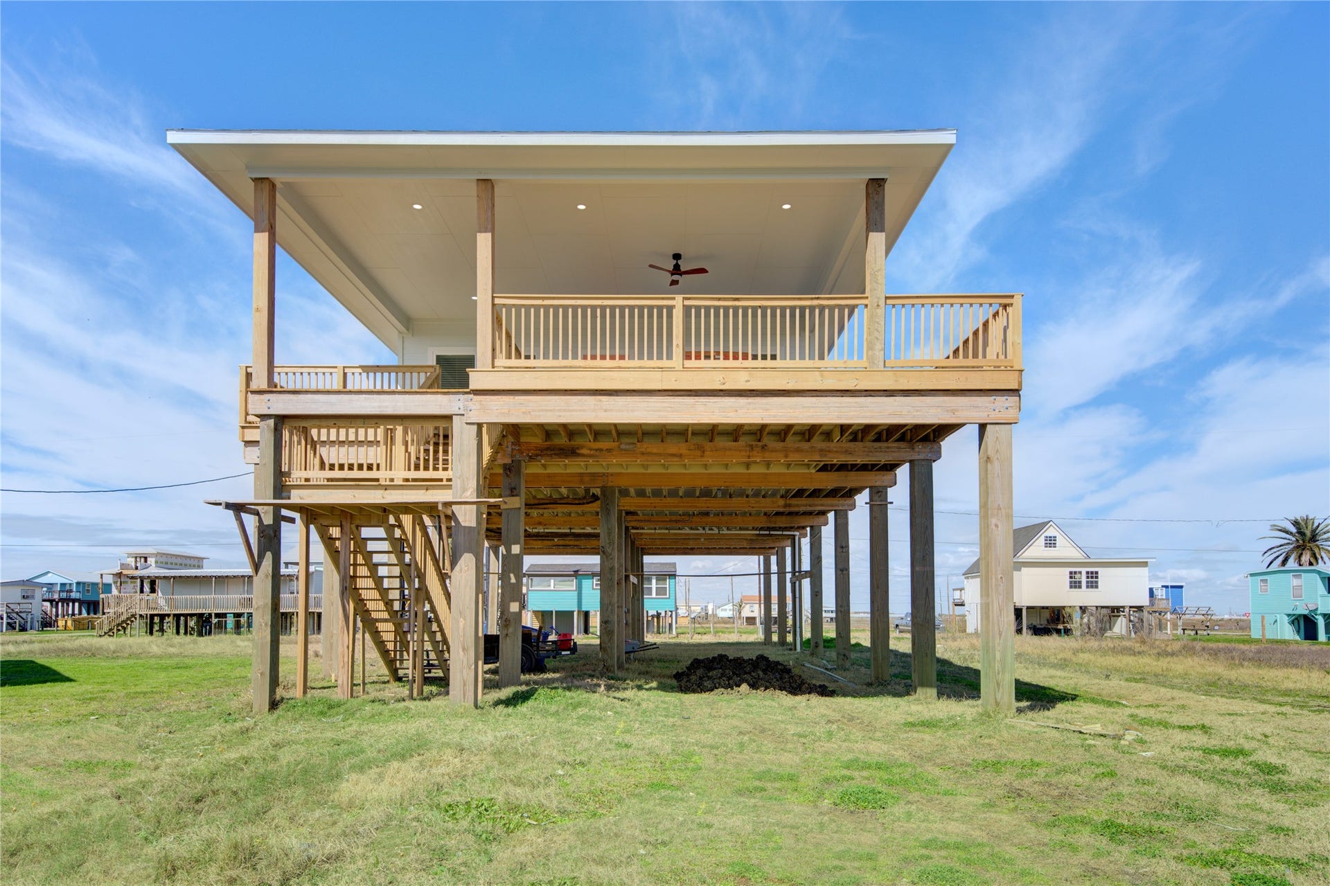 1014 Treaty Dr, Surfside Beach, TX 77541 Elevated home design with covered parking and entertaining space below