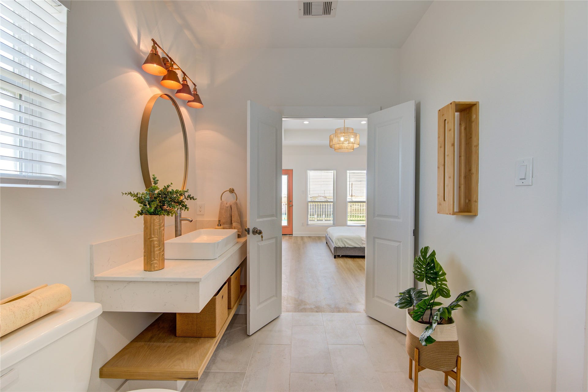 1014 Treaty Dr, Surfside Beach, TX 77541 Primary bathroom featuring double sinks, large shower, and walk-in closet access