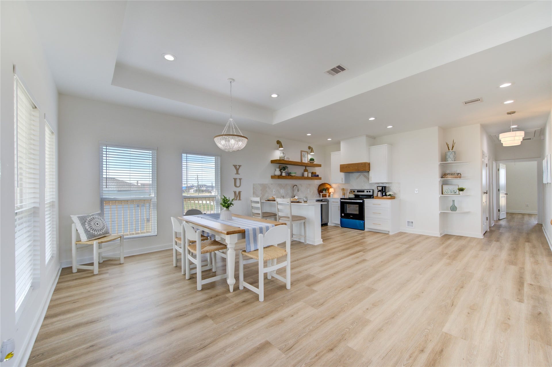 1014 Treaty Dr, Surfside Beach, TX 77541 Dining area with stylish pendant lighting and open flow to living spaces