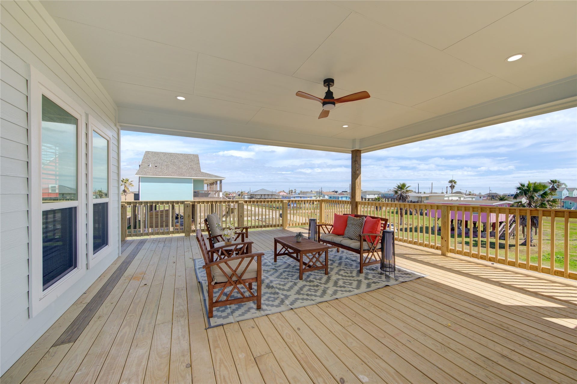 1014 Treaty Dr, Surfside Beach, TX 77541 Spacious covered patio perfect for outdoor dining and relaxing coastal living