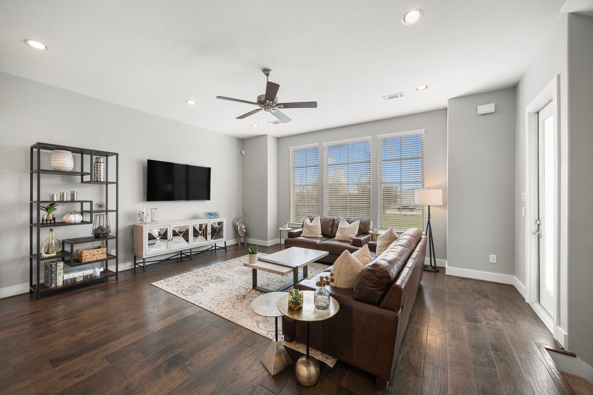 1216 Murrayhill Drive, Houston, TX 77043 Luxurious family room with abundant natural light and elegant finishes.