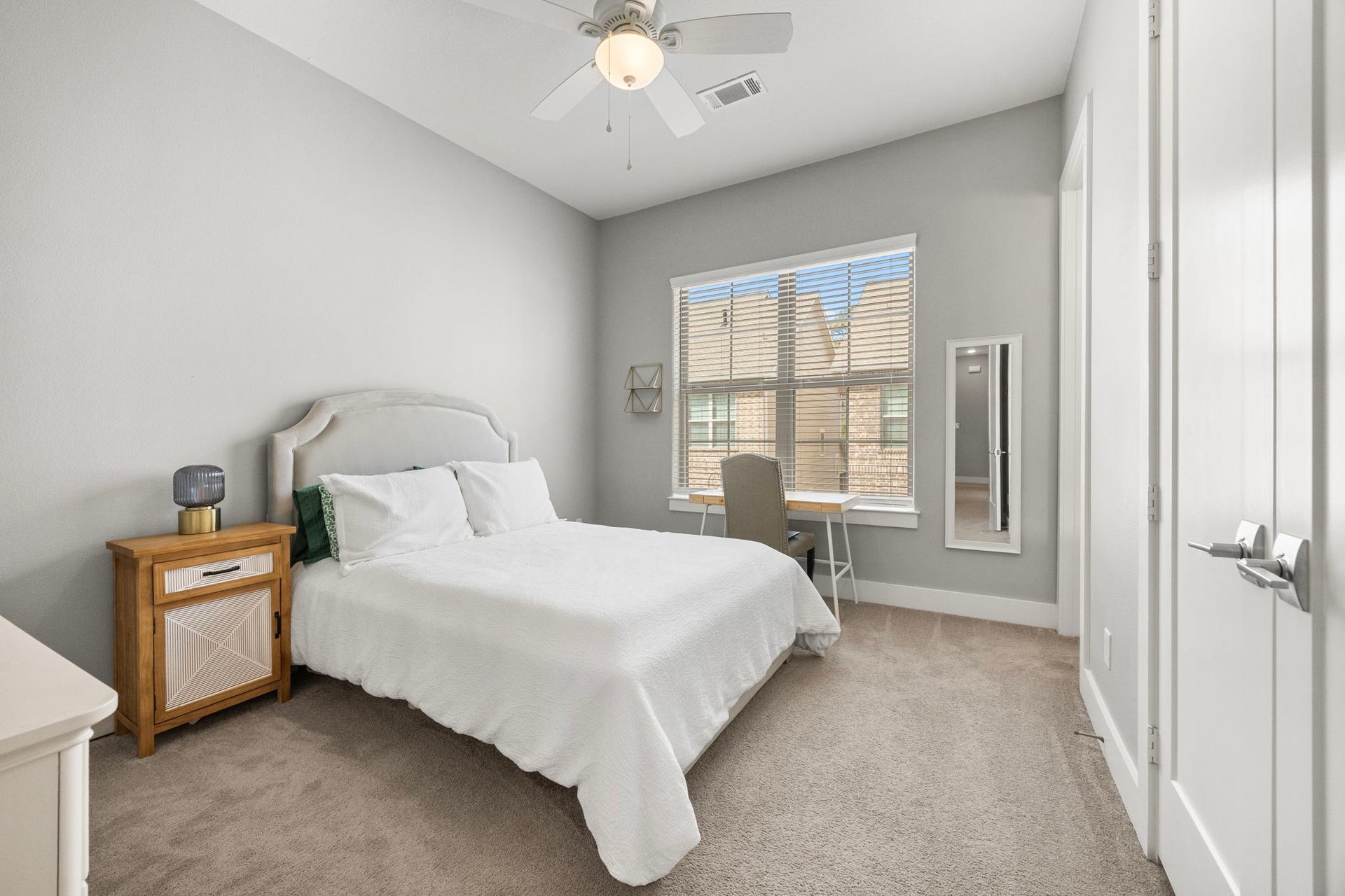 1216 Murrayhill Drive, Houston, TX 77043 Spacious third-floor bedroom with natural light and cozy ambiance.