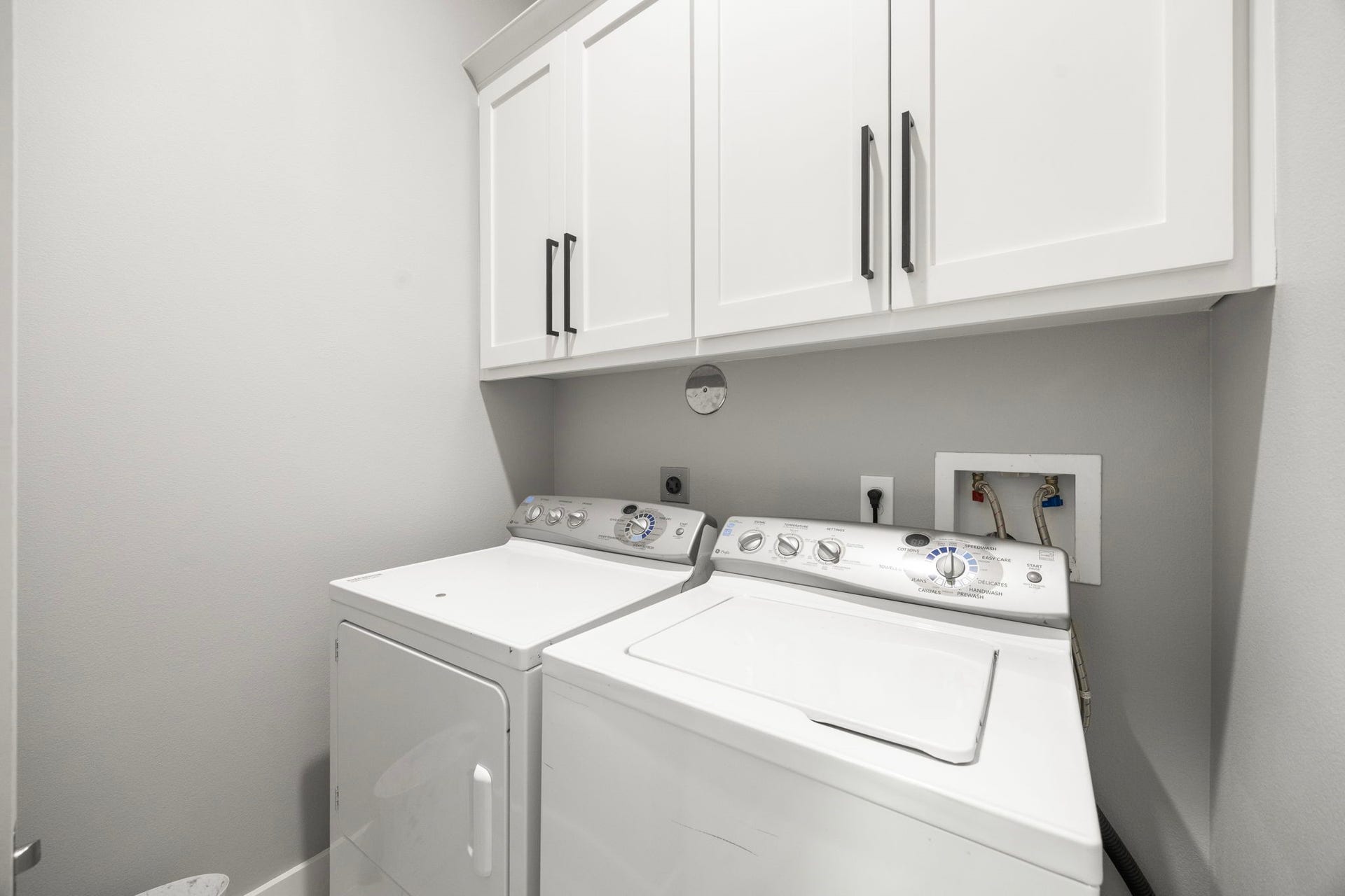 1216 Murrayhill Drive, Houston, TX 77043 Spacious and efficient laundry room featuring ample cabinet storage for a seamless laundry experience. Washer and Dryer Excluded