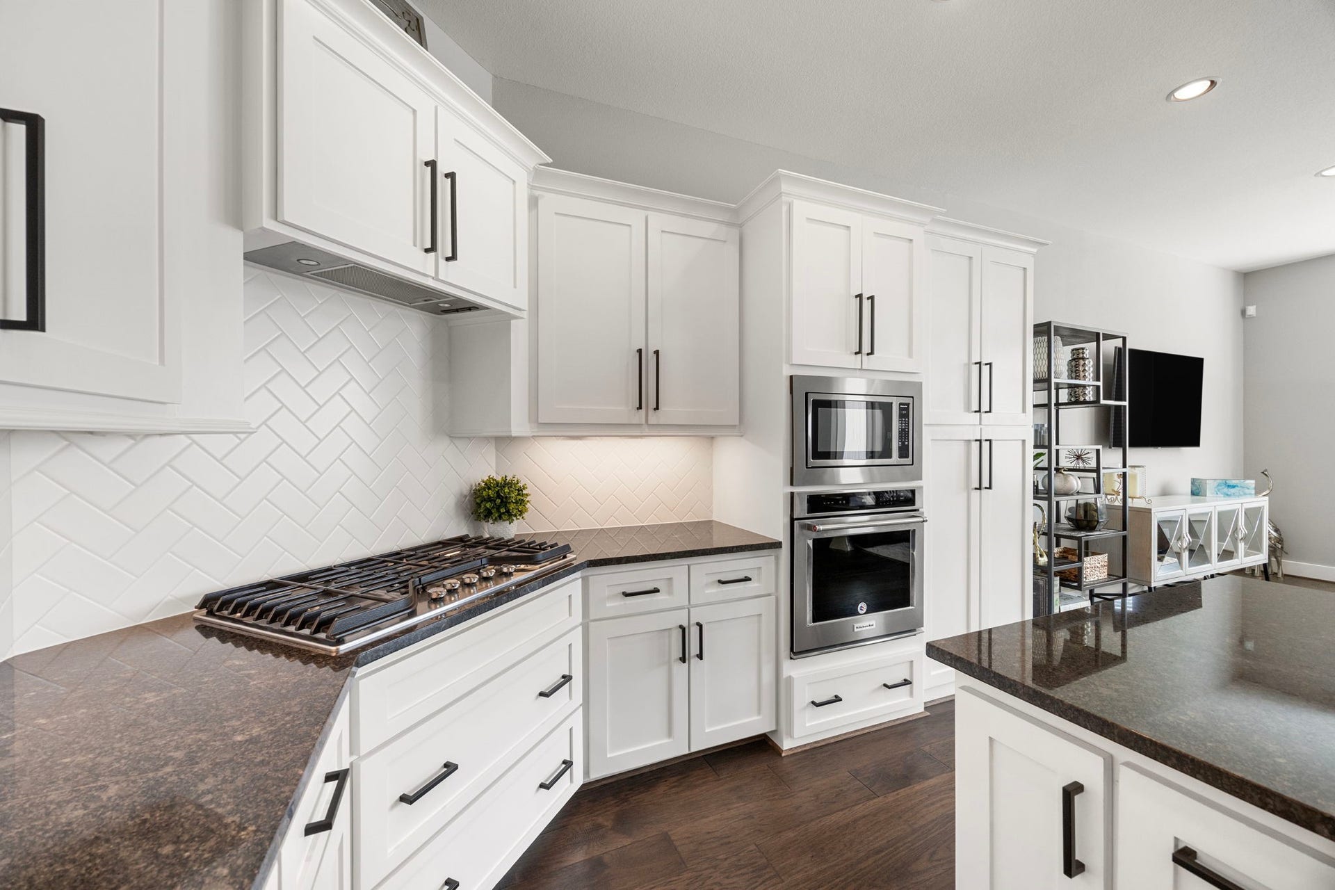 1216 Murrayhill Drive, Houston, TX 77043 Elegant gas cooktop with stylishly accented cabinetry.