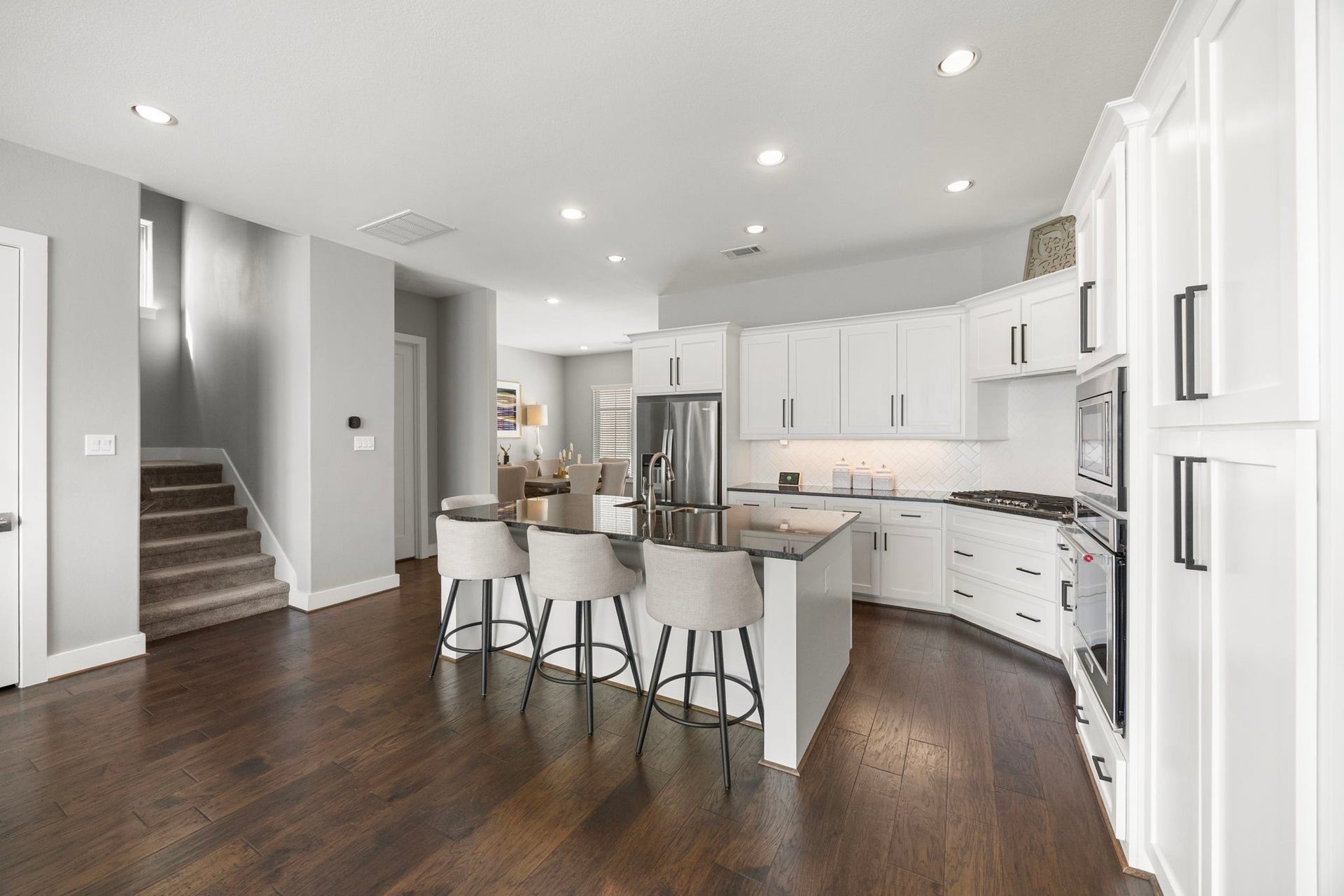 1216 Murrayhill Drive, Houston, TX 77043 This spacious breakfast bar features a large storage closet, offering conversion options for an elevator installation.