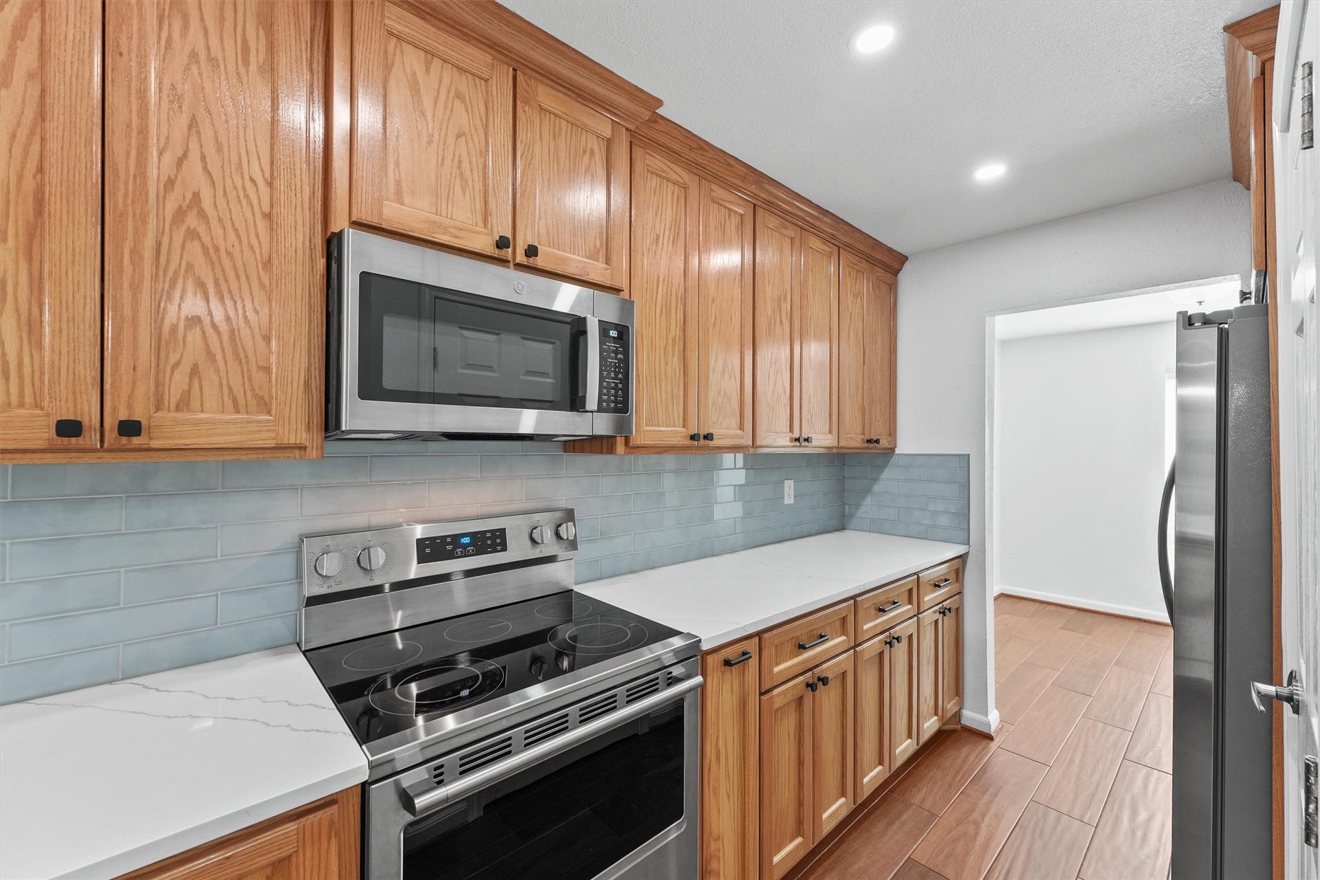 11550 Chimney Rock Road, #536, Houston, TX 77035 Quartz countertops, upgraded subway tiled backsplash, stainless steel appliances with custom wooden cabinetry and hardware