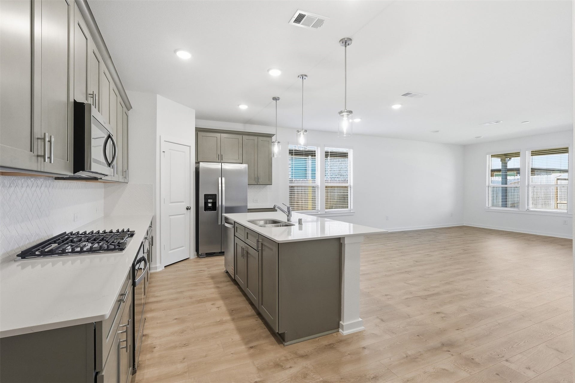 18210 Ellerden Forest Drive, Tomball, TX 77377 Island Kitchen opens to dining and family room.