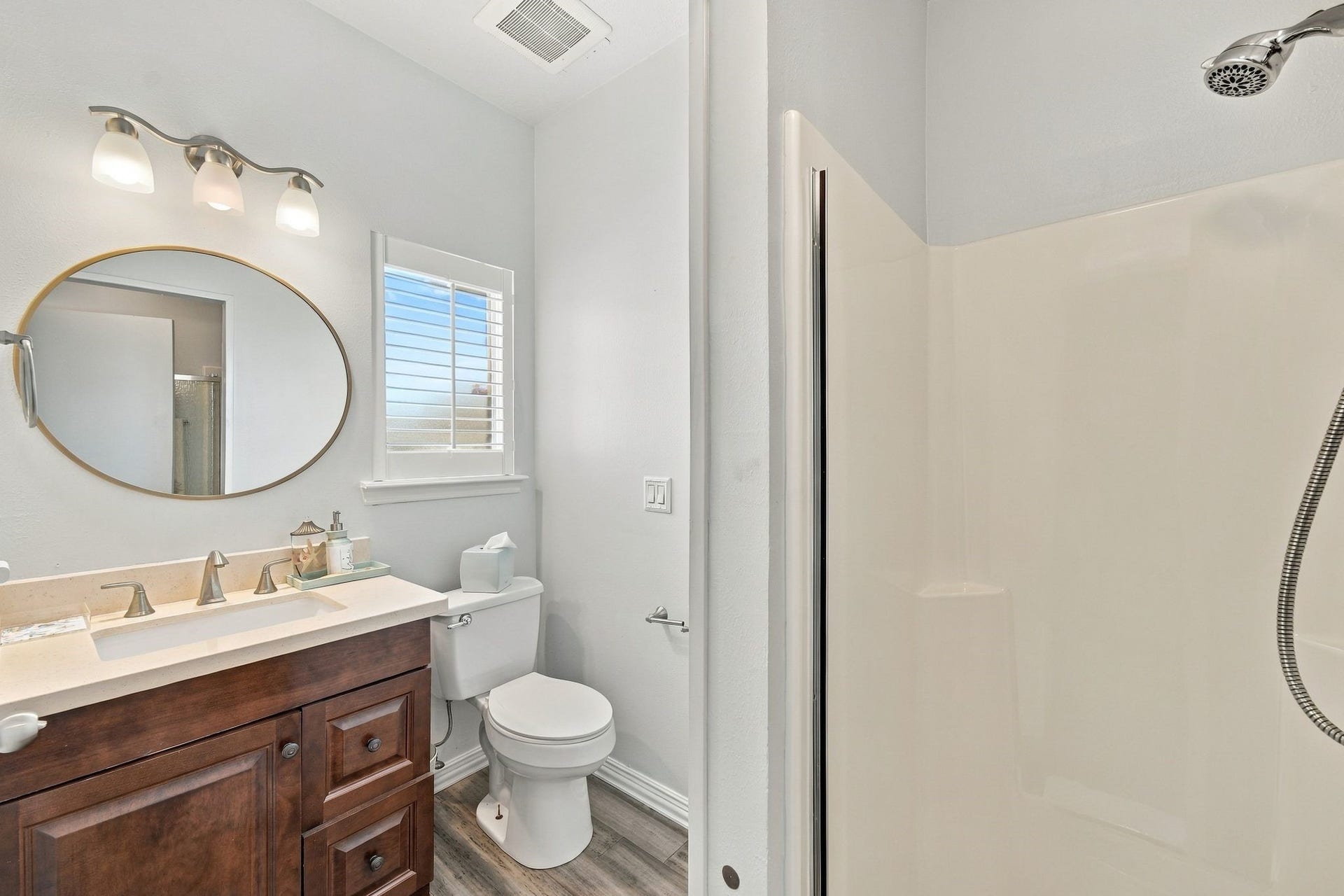 932 Plantation Street, League City, TX 77573 The full bathroom features a single vanity and a walk-in shower.
