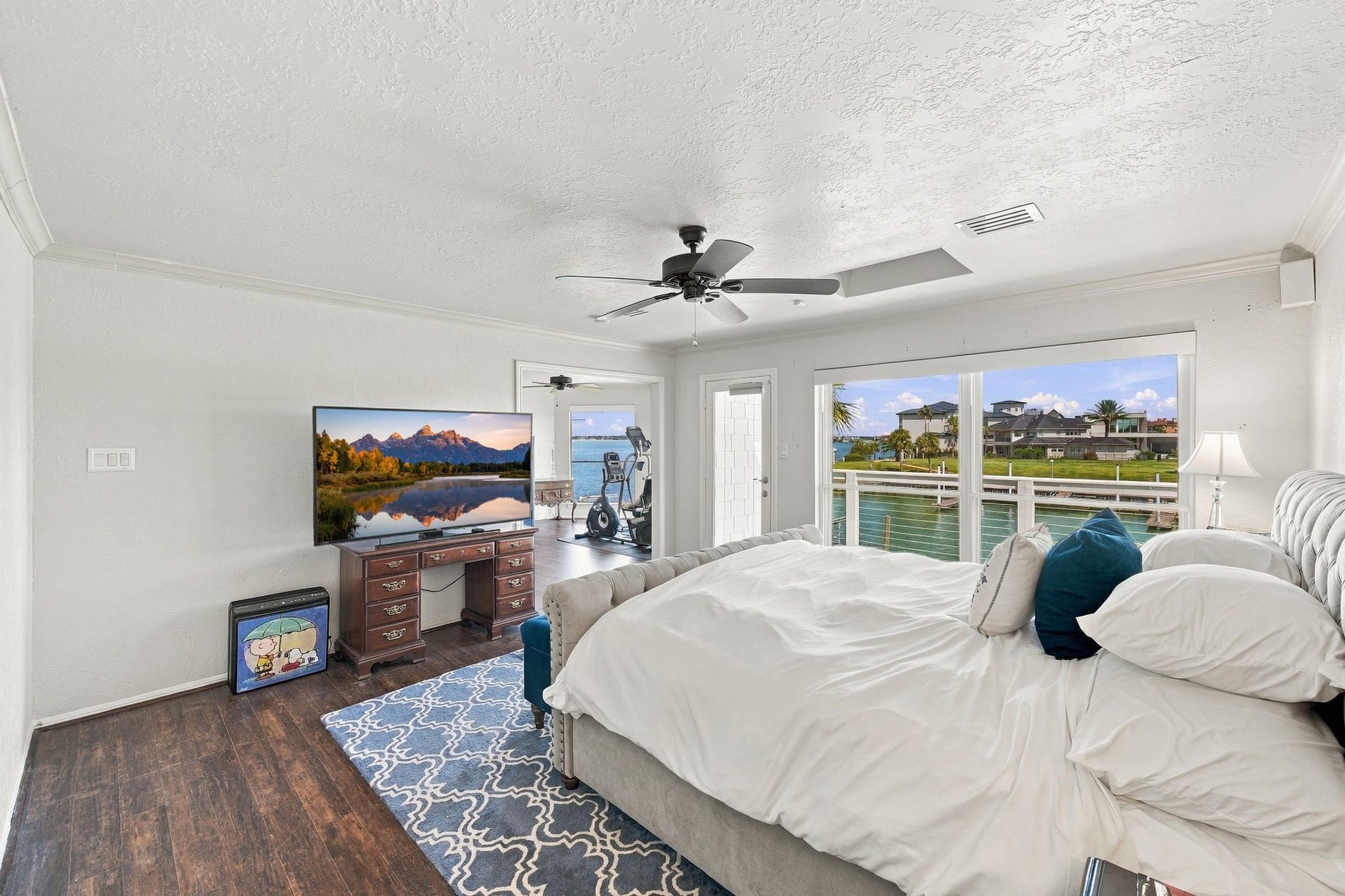932 Plantation Street, League City, TX 77573 The primary bedroom has large windows with beautiful water views.