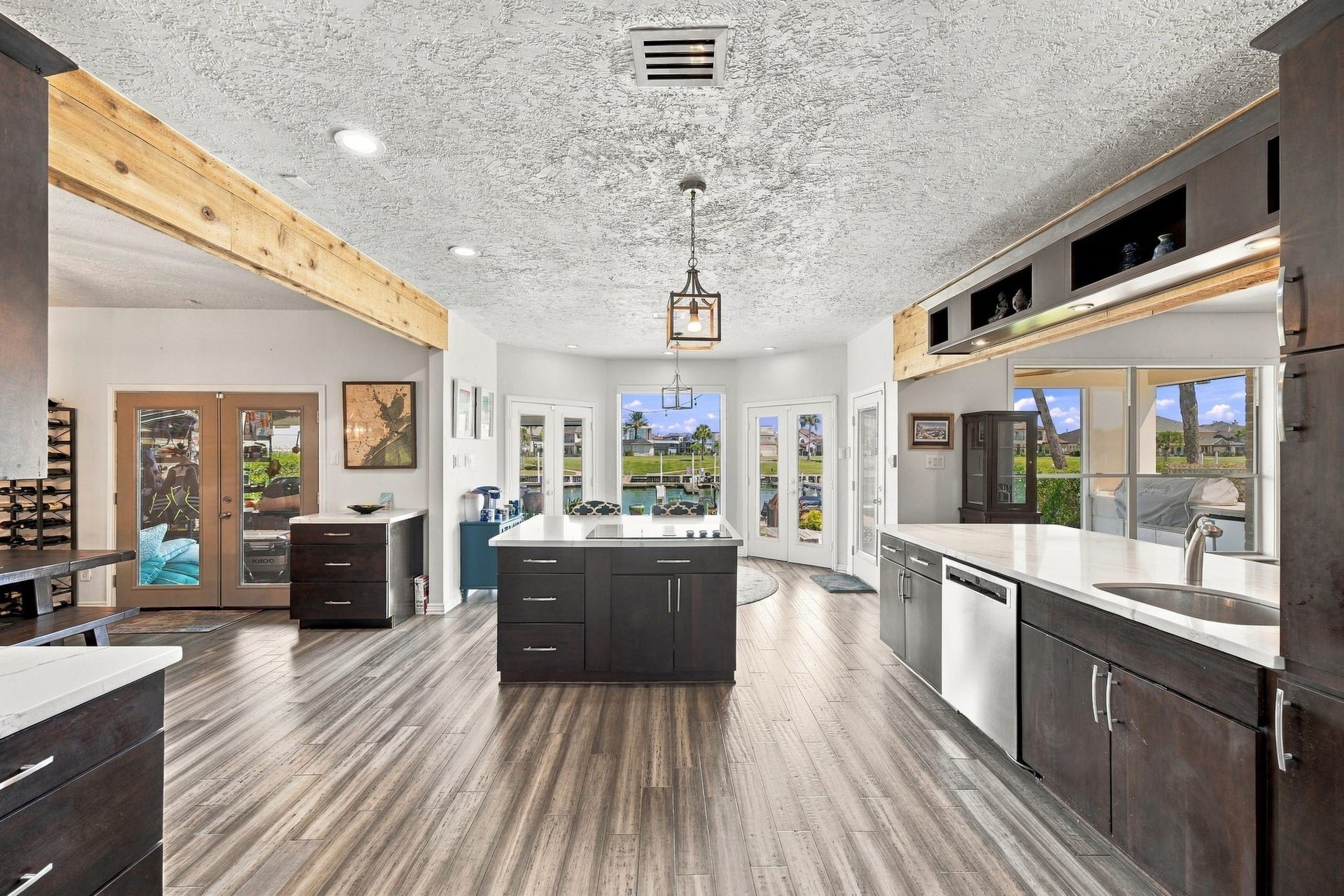 932 Plantation Street, League City, TX 77573 Stainless steel appliances and large windows fill the kitchen with abundant natural light.